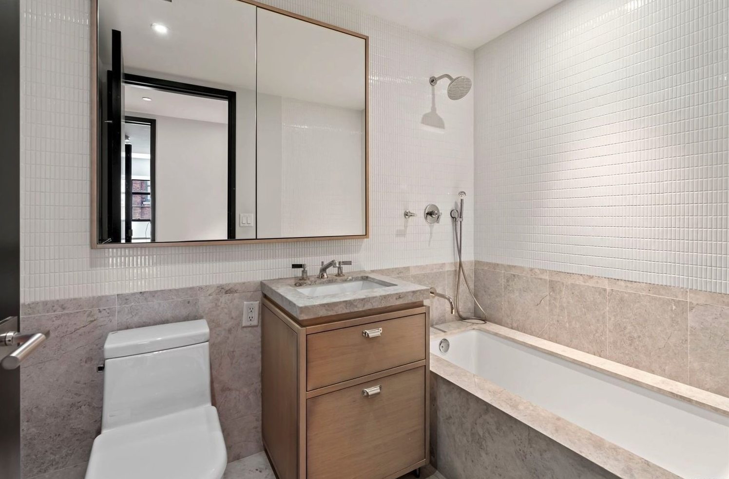 51 Jay Street, Unit 5M Brooklyn, NY 11201 - Photo 7 of 17 a bathroom with a toilet sink and mirror