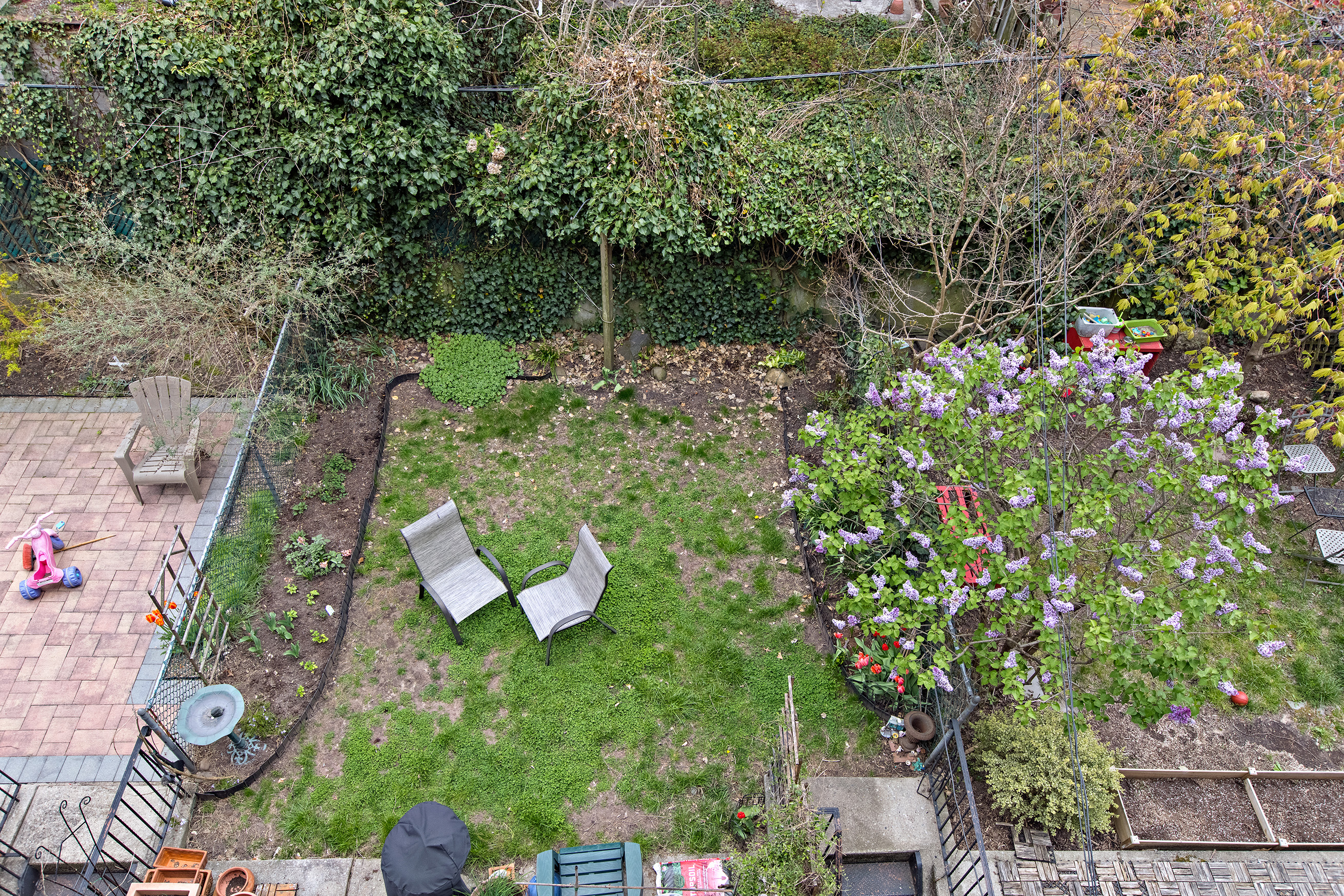 454 12th Street, Unit 3 Brooklyn, NY 11215 - Photo 13 of 18 a view of a garden with plants and a bench