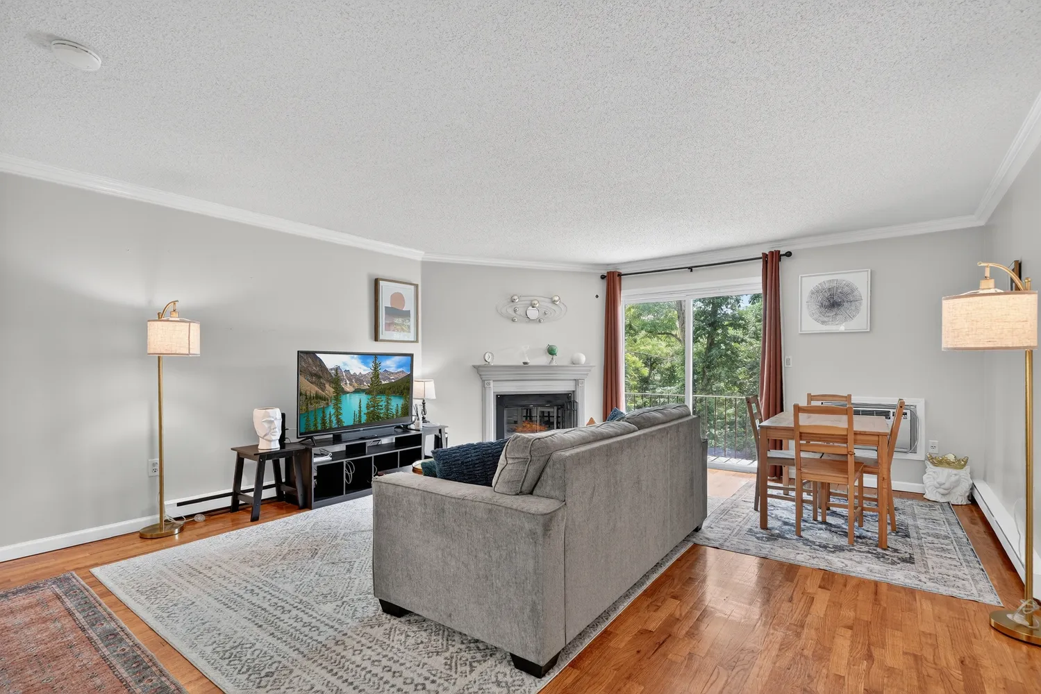 a living room with furniture fireplace and a table