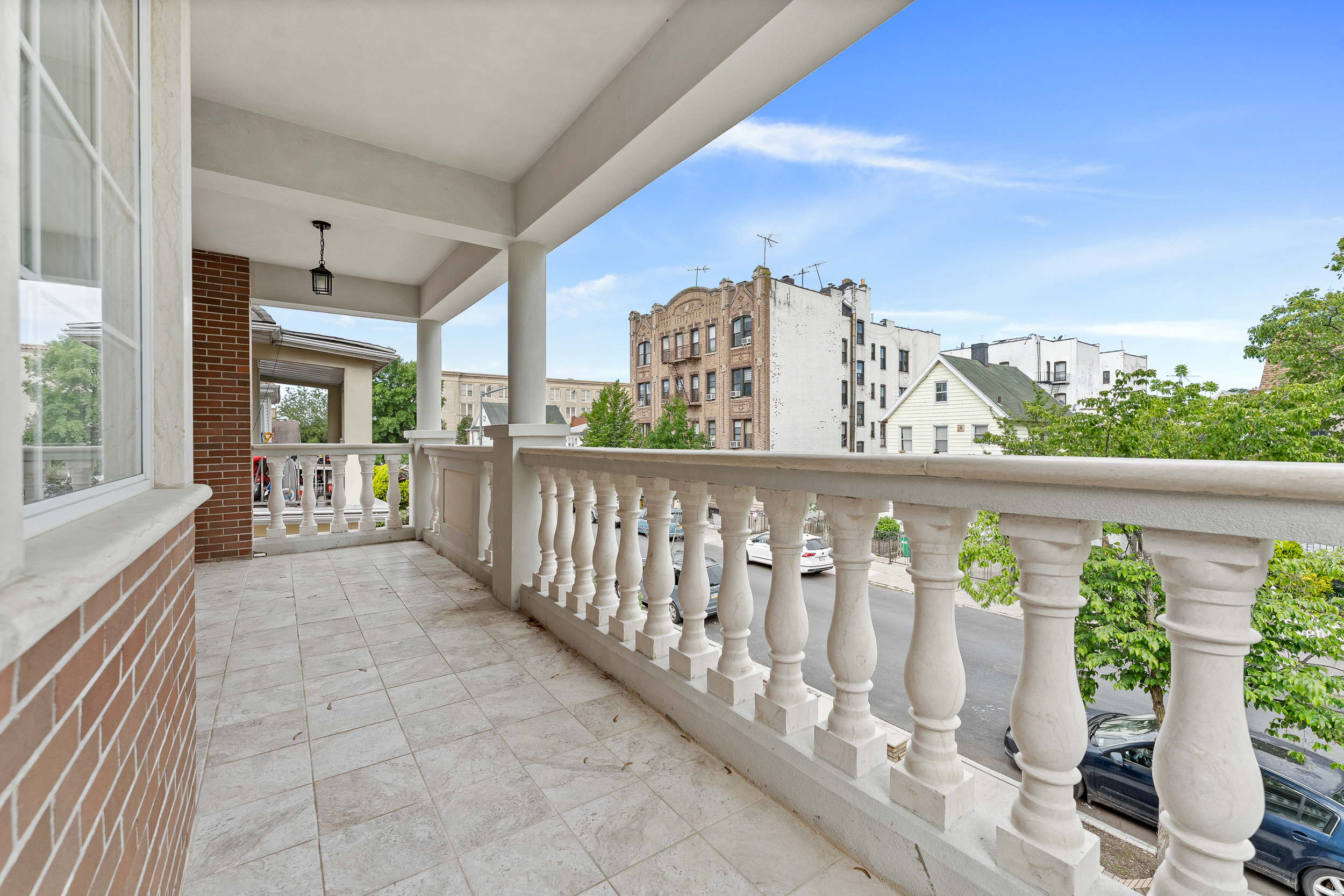 65 Bay 23rd Street, Unit 2 Brooklyn, NY 11214 - Photo 15 of 16 a view of a balcony with wooden floor