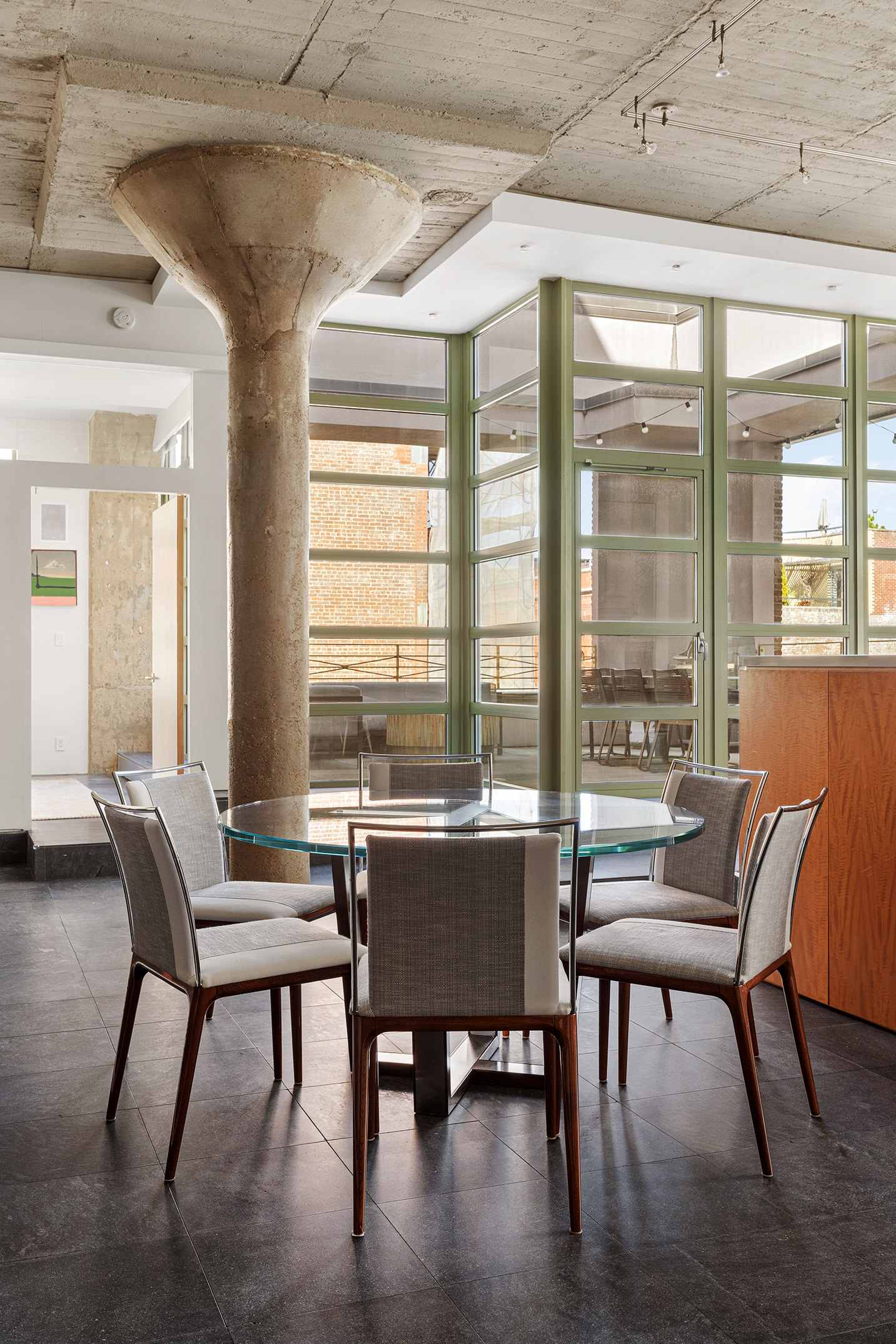195 Hudson Street, Unit 6A Manhattan, NY 10013 - Photo 4 of 15 a view of a dining room with furniture window and outside view