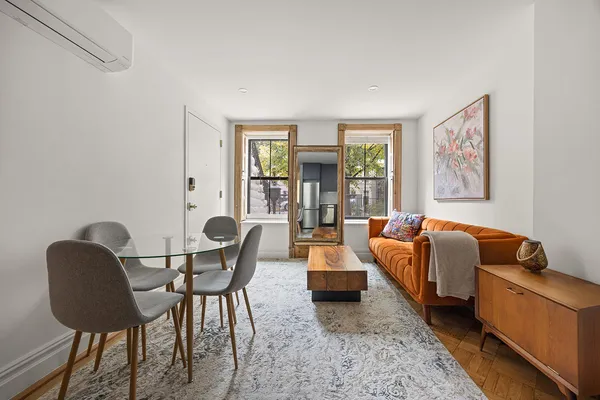 a living room with furniture and a window