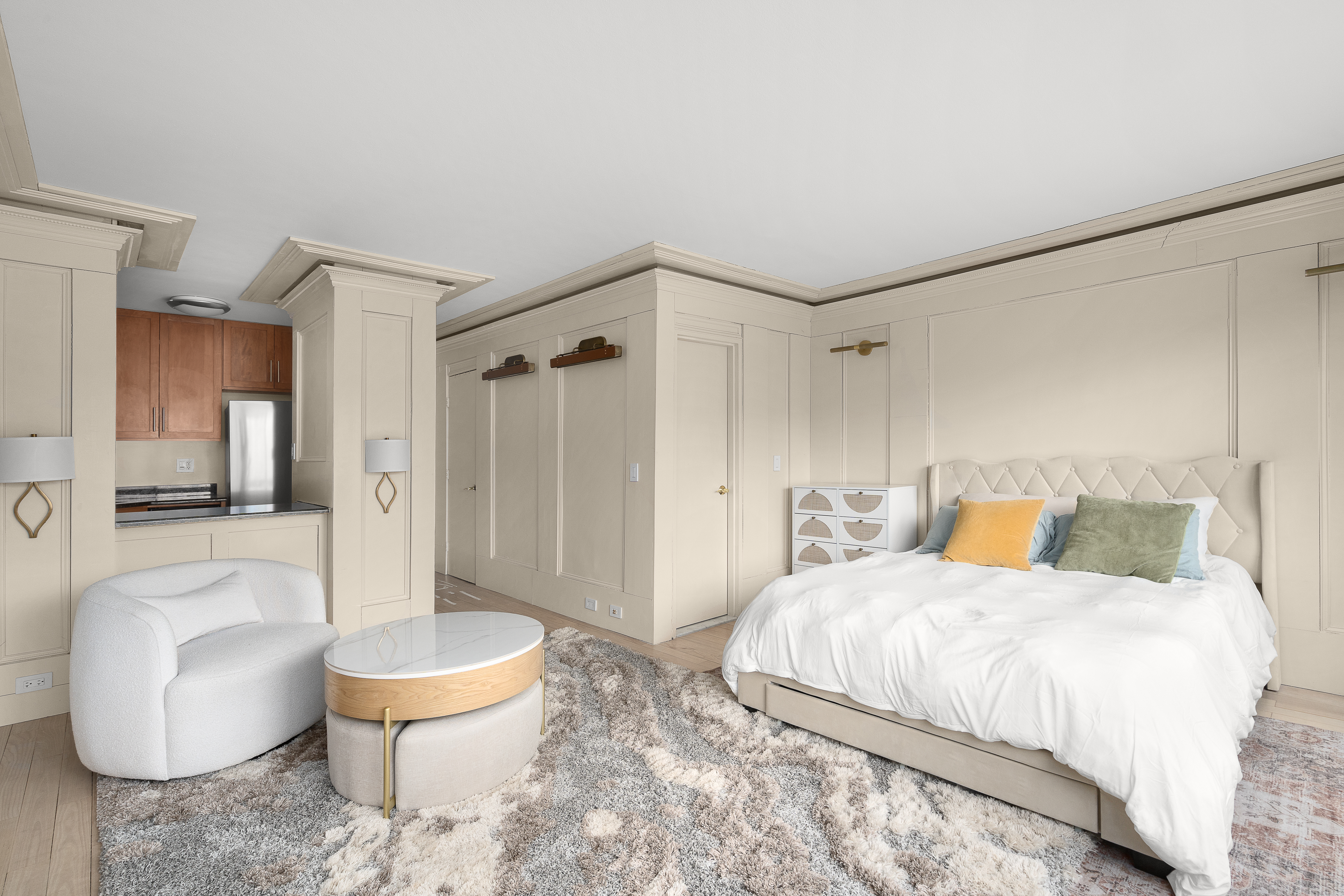 201 West 21st Street, Unit 8G Manhattan, NY 10011 - Photo 2 of 8 a bedroom with a bed and a couch