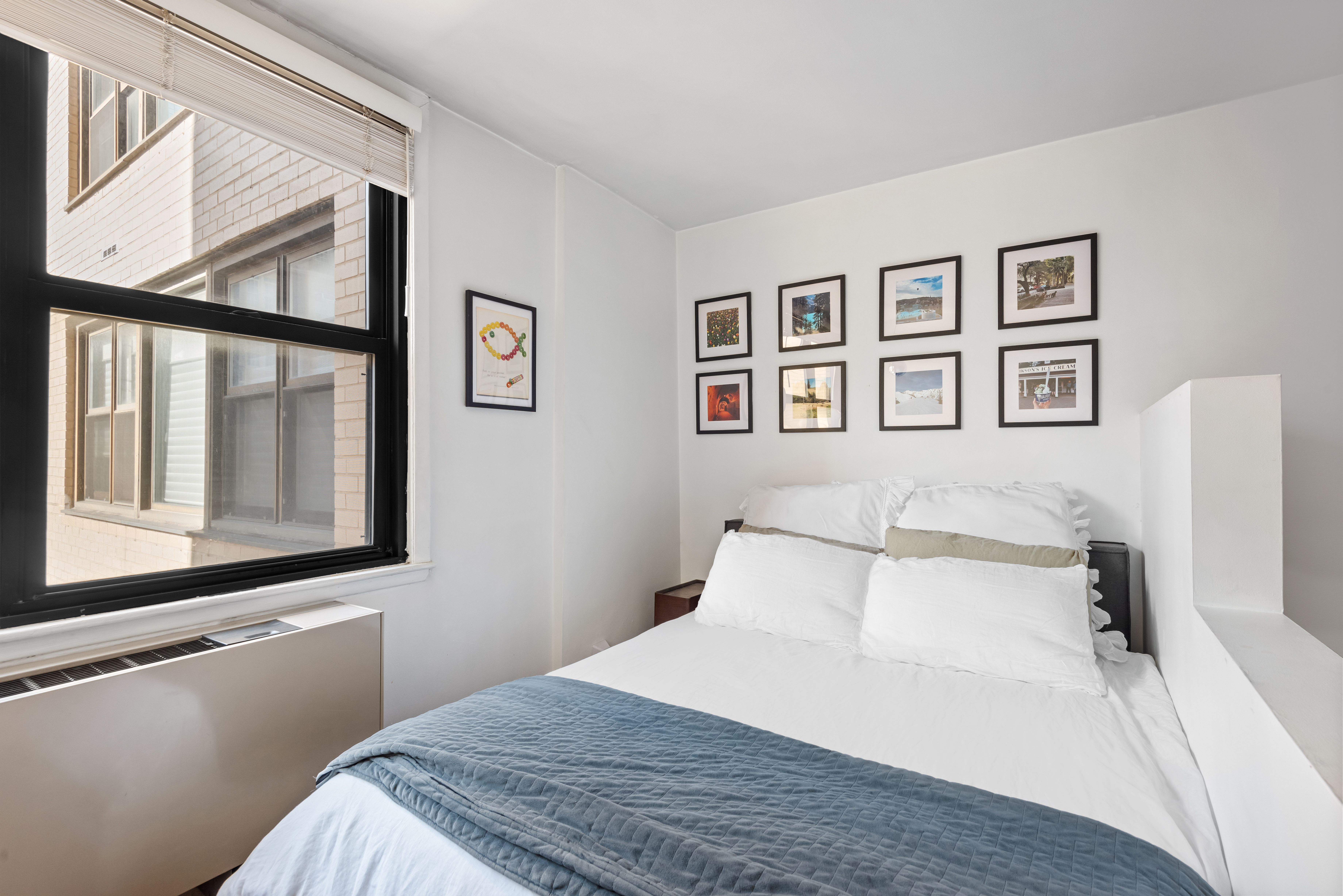 130 East 18th Street, Unit 8R Manhattan, NY 10003 - Photo 6 of 9 a bedroom with a bed and a window