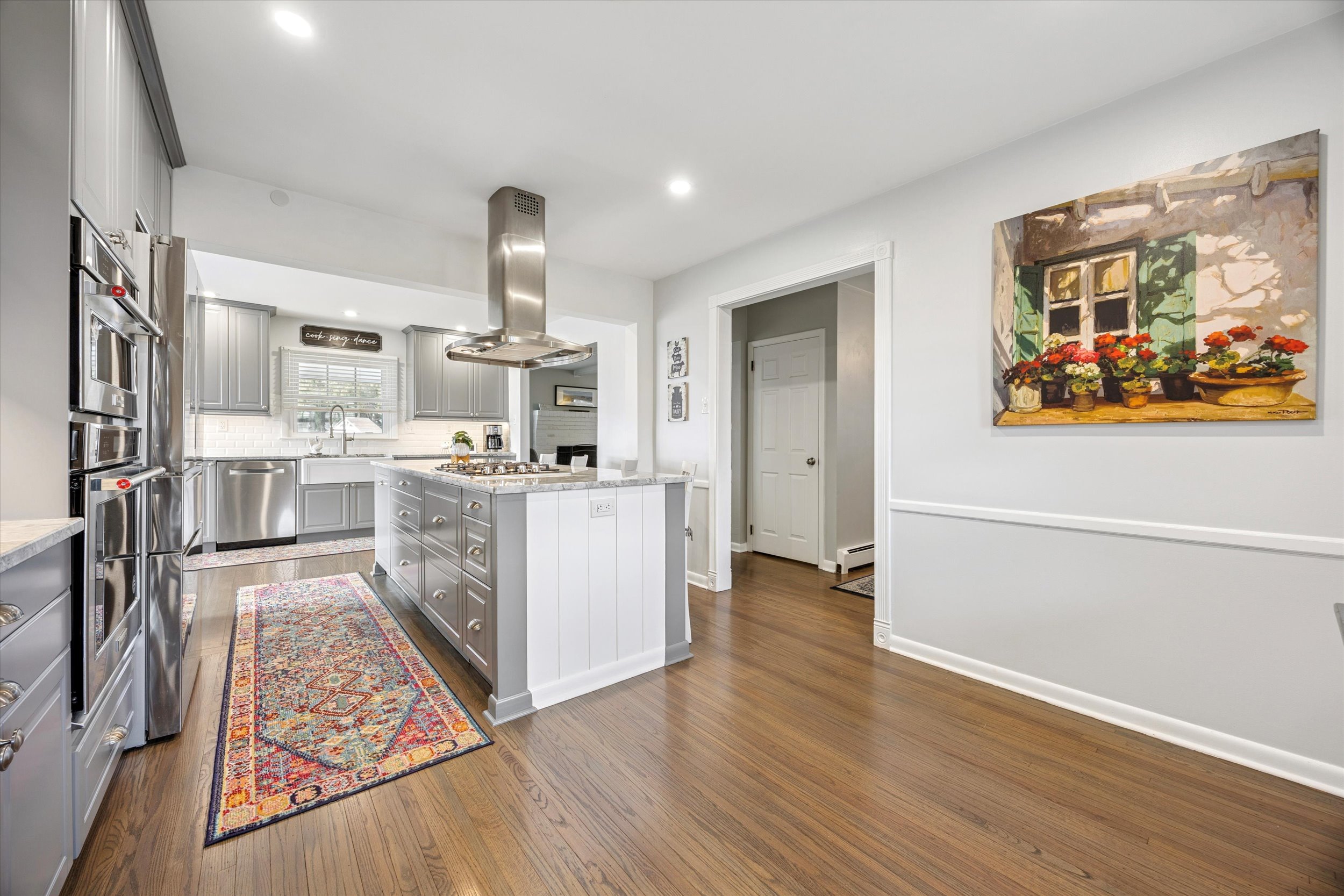 535 Bell Lane Ambler, PA 19002 - Photo 8 of 45 a living room with stainless steel appliances kitchen island granite countertop a refrigerator stove and wooden floor