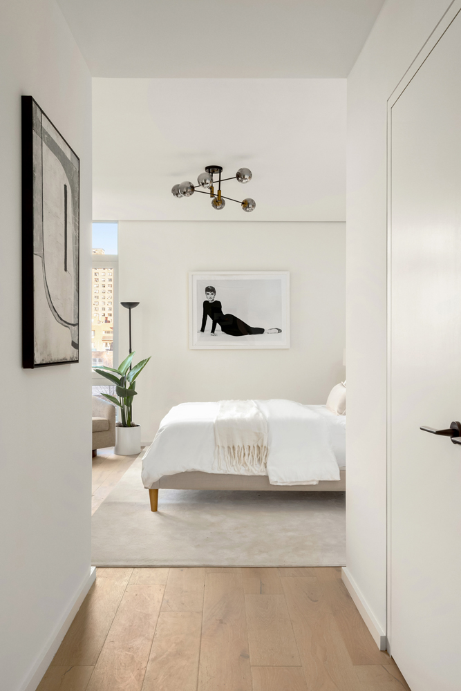 66 Clinton Street, Unit 4B Manhattan, NY 10002 - Photo 9 of 18 a en suite bathroom with a bathtub and mirror