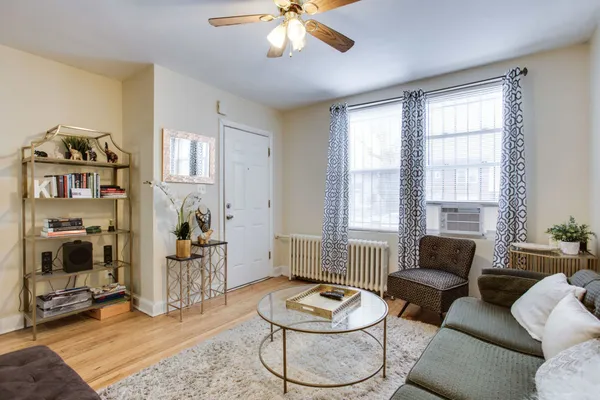 a living room with furniture and a window