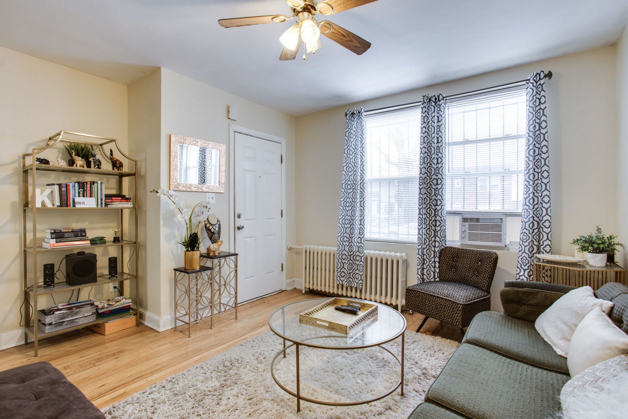 928 19th Street Northeast Washington, DC 20002 - Photo 5 of 13 a living room with furniture and a window