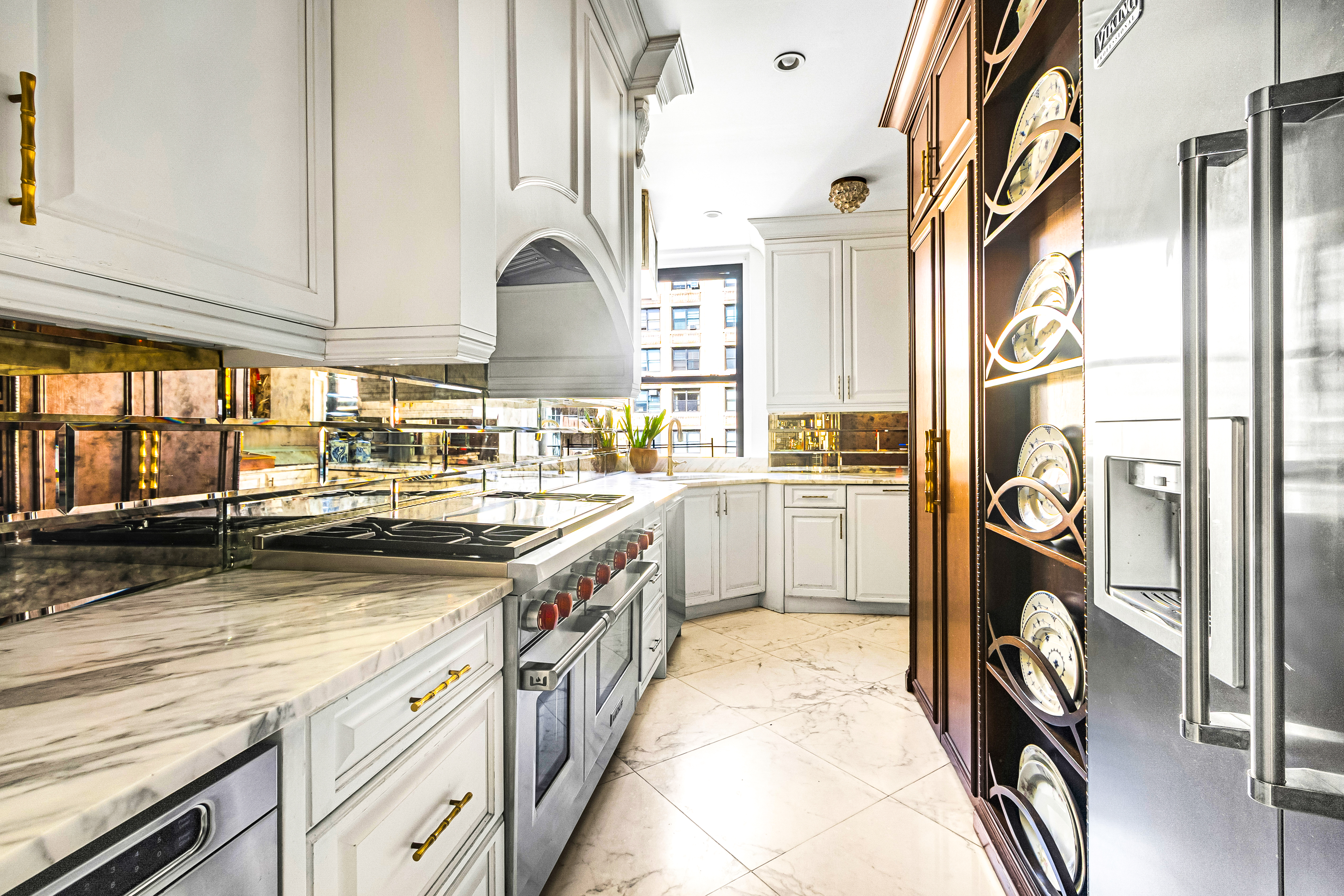 205 West 89th Street, Unit 6RS Manhattan, NY 10024 - Photo 4 of 19 a kitchen with cabinets and a stove
