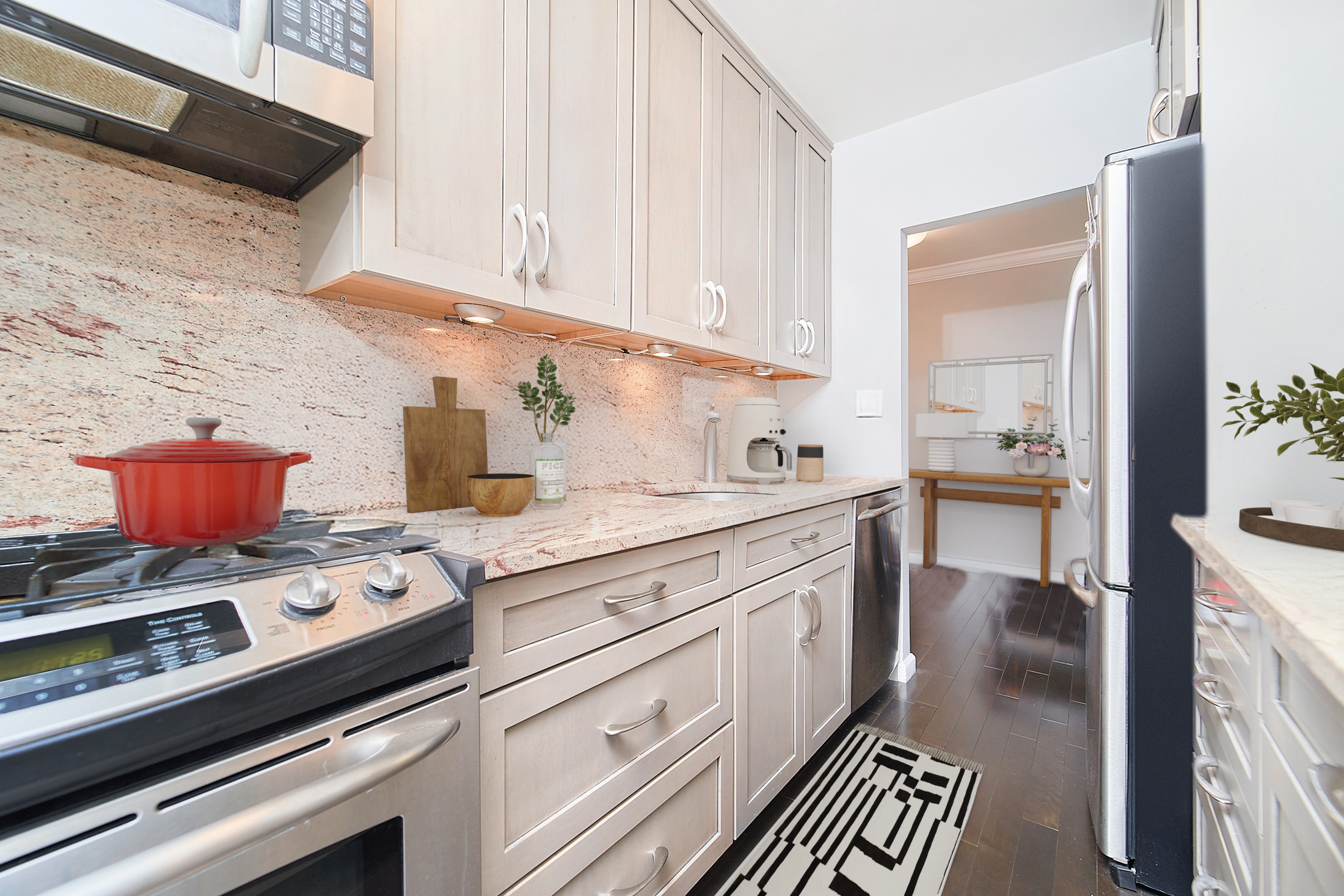 175 Willoughby Street, Unit 6K Brooklyn, NY 11201 - Photo 4 of 14 a kitchen with stainless steel appliances granite countertop a stove and white cabinets