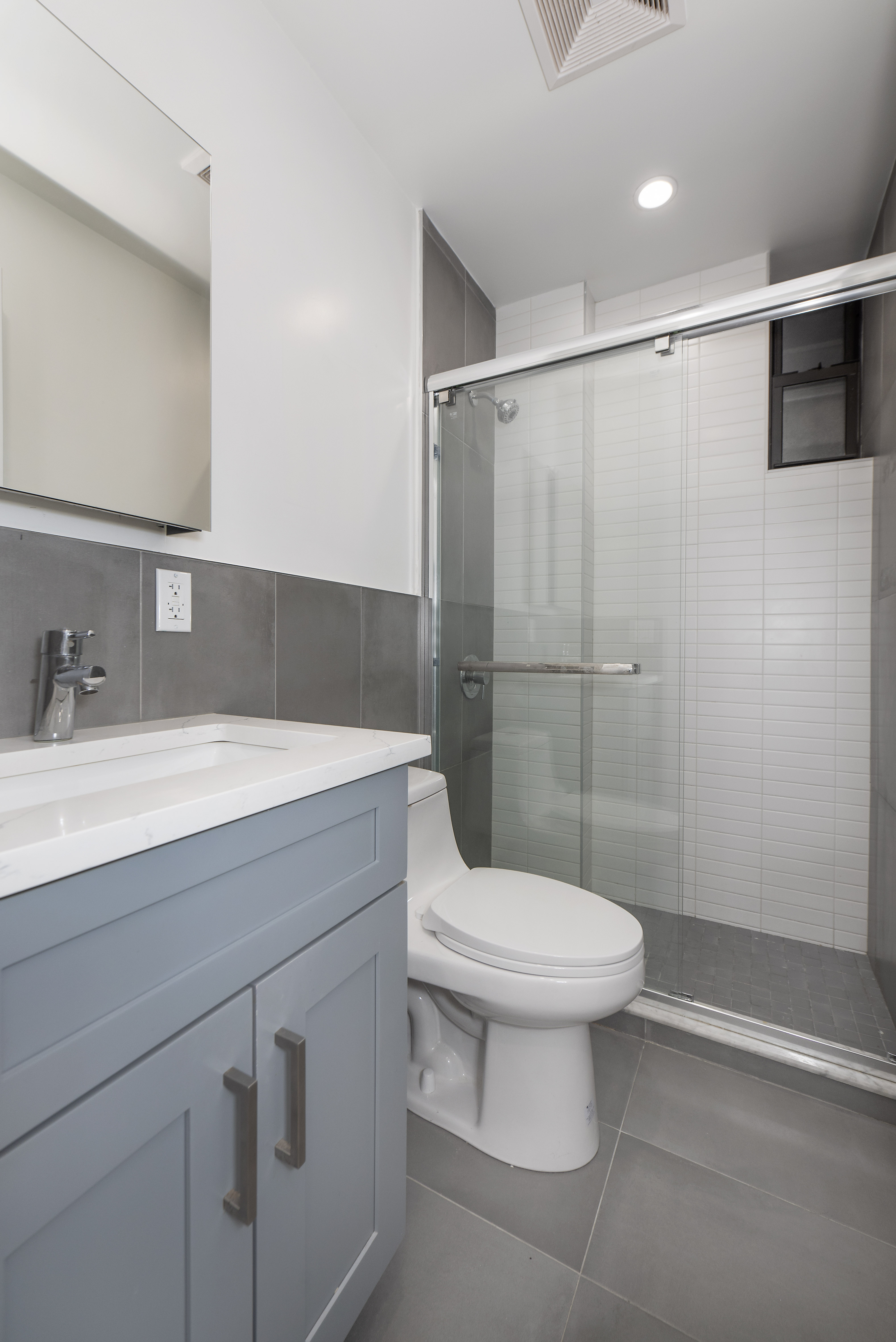 129 2nd Avenue, Unit 8 Manhattan, NY 10003 - Photo 7 of 11 a bathroom with a sink toilet and shower