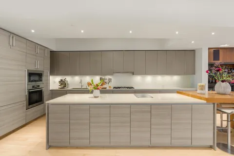 a kitchen with a sink and cabinets