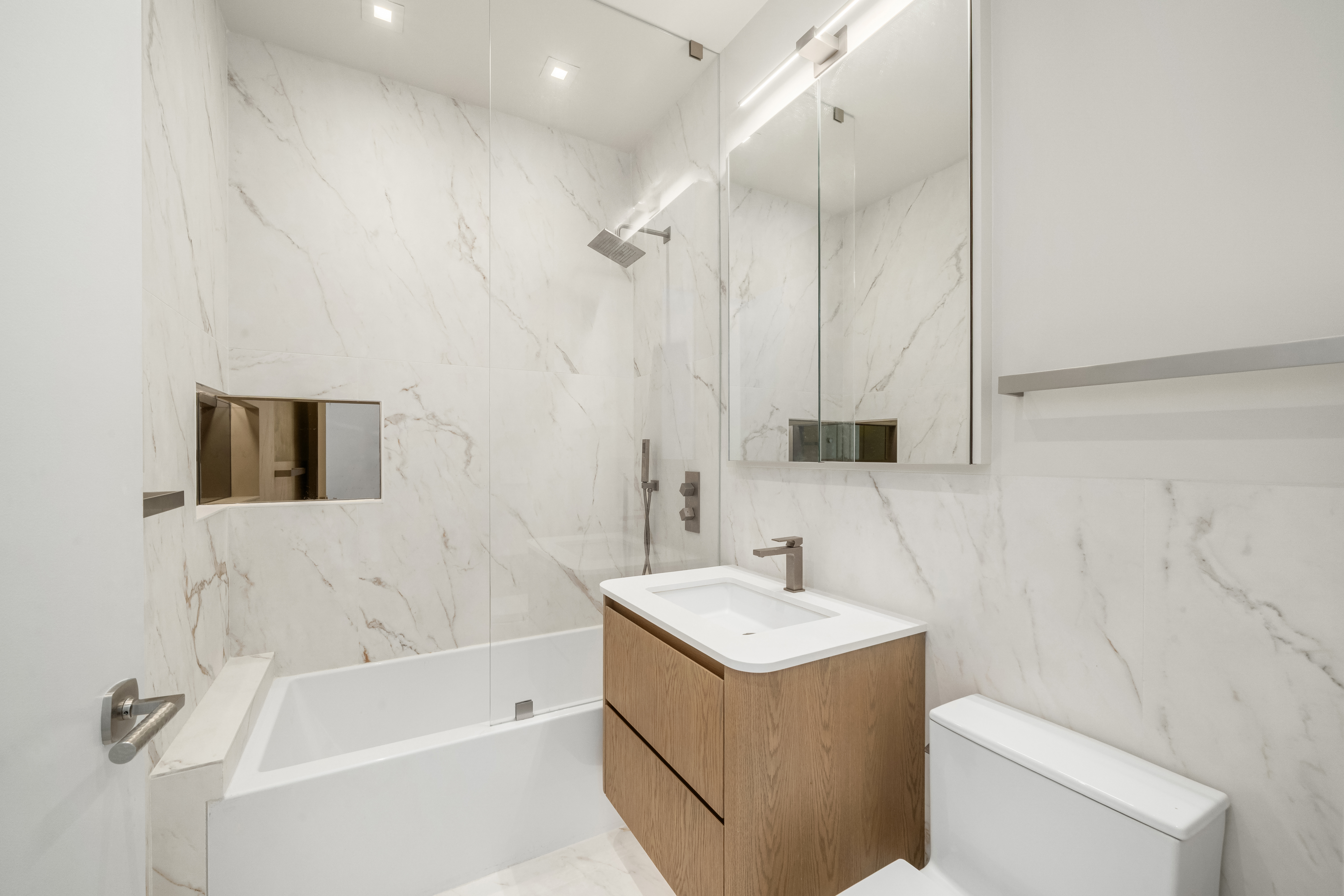 100 Morton Street, Unit 7EW Manhattan, NY 10014 - Photo 16 of 21 a bathroom with a sink a toilet and shower