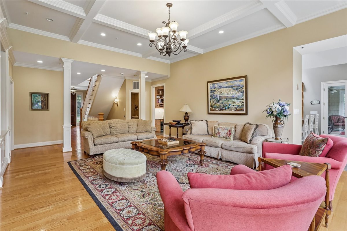 11736 Gainsborough Road Potomac, MD 20854 - Photo 27 of 90 a living room with furniture a chandelier and a rug