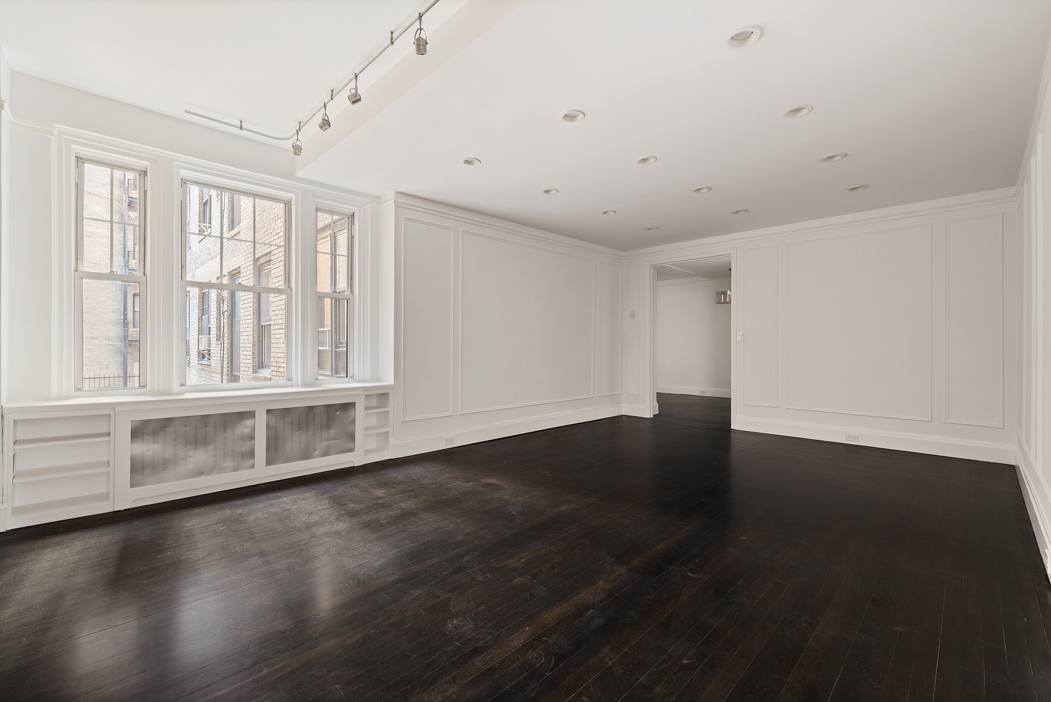 310 West End Avenue, Unit 2A Manhattan, NY 10023 - Photo 9 of 19 a view of an empty room with wooden floor and a window