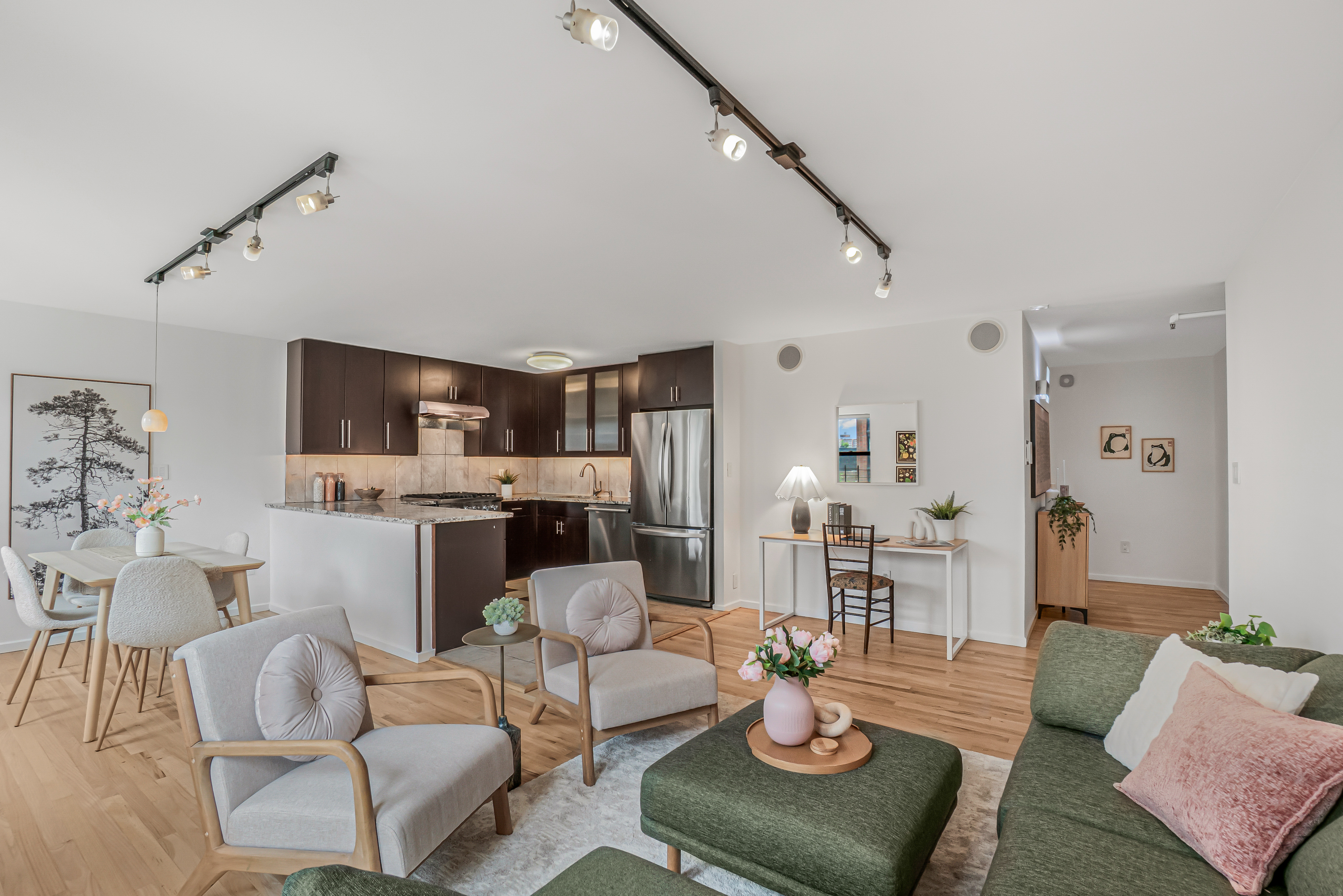 7 Gates Avenue, Unit H Brooklyn, NY 11238 - Photo 2 of 20 a living room with furniture couches and a dining table with kitchen view