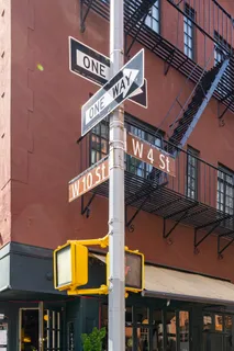 a street sign on a brick building