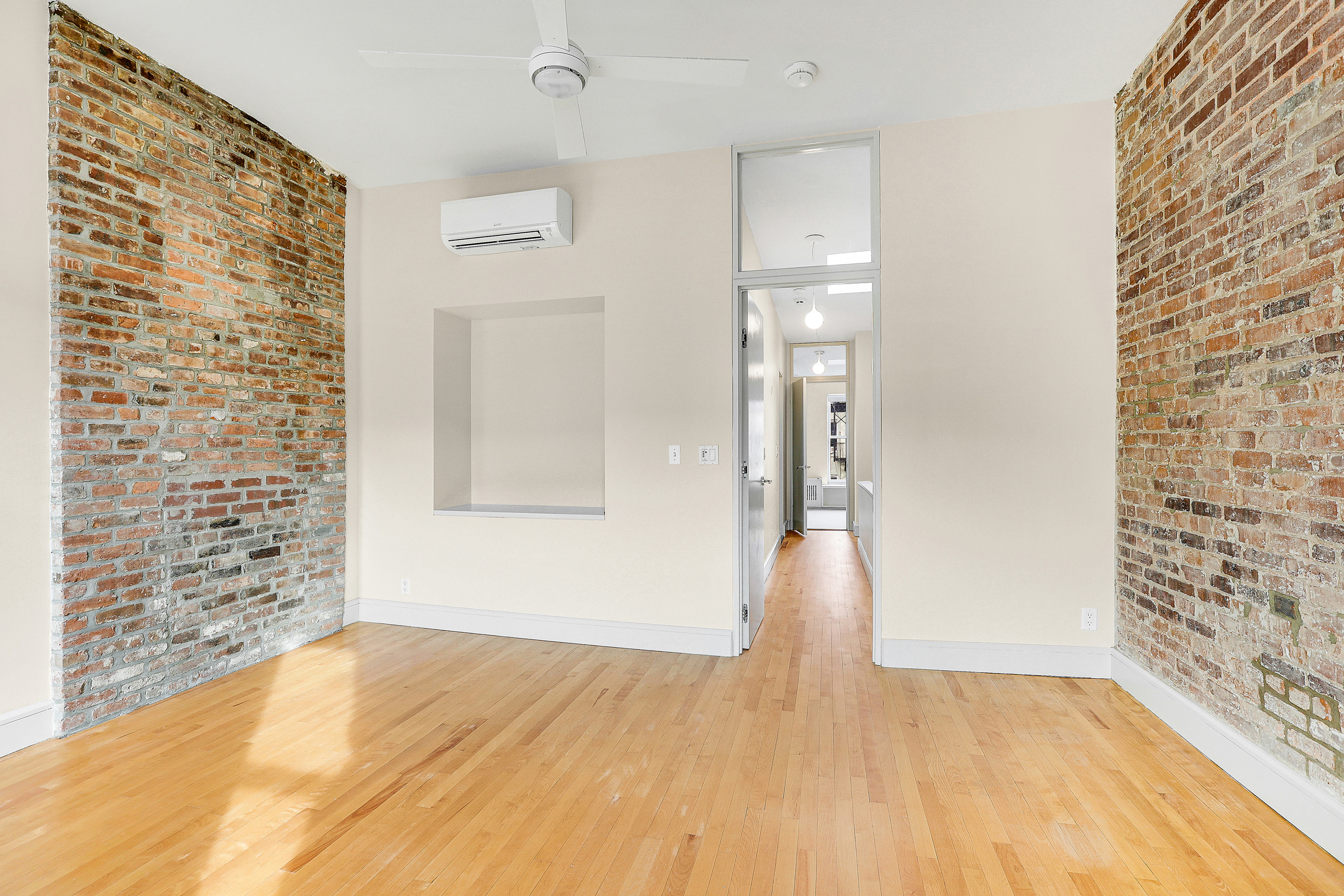 187 President Street, Unit 2 Brooklyn, NY 11231 - Photo 10 of 17 a view of empty room with wooden floor and bathroom