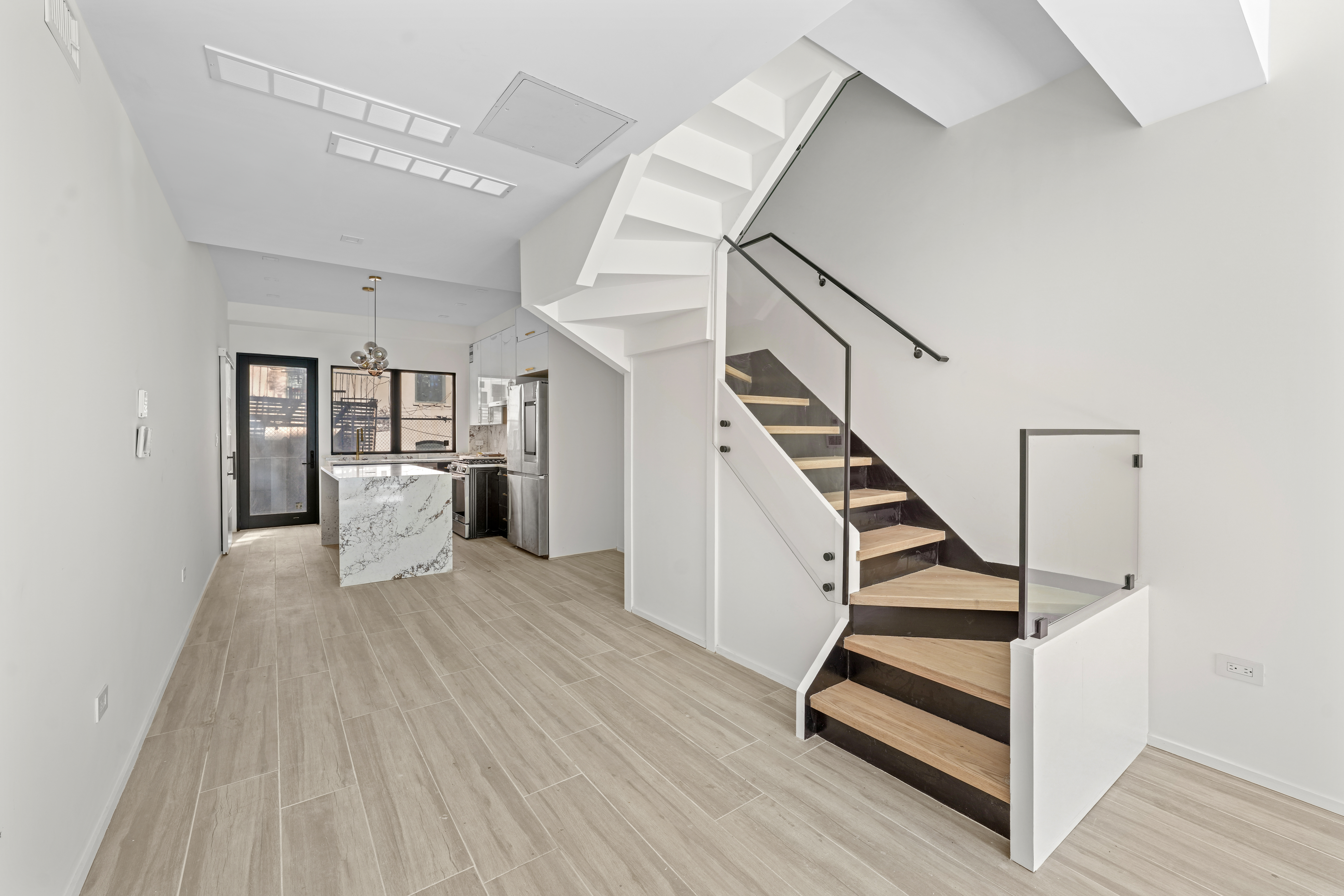 953 St Nicholas Avenue, Unit 1 Manhattan, NY 10032 - Photo 4 of 15 a view of entryway and hall with wooden floor