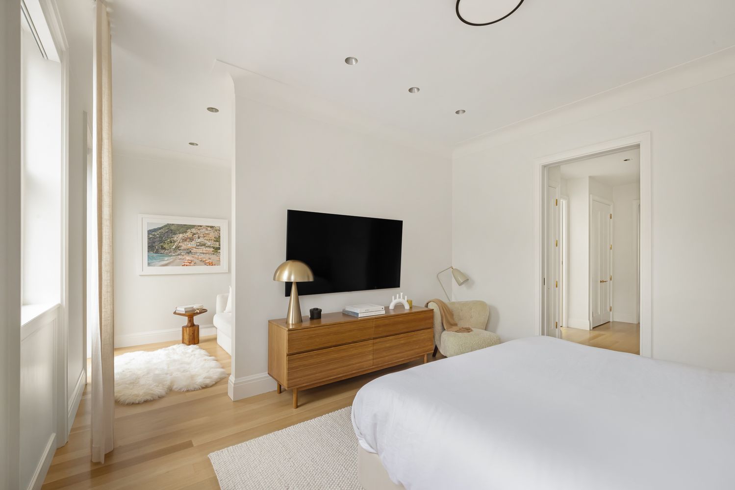 a bedroom with bed and tv