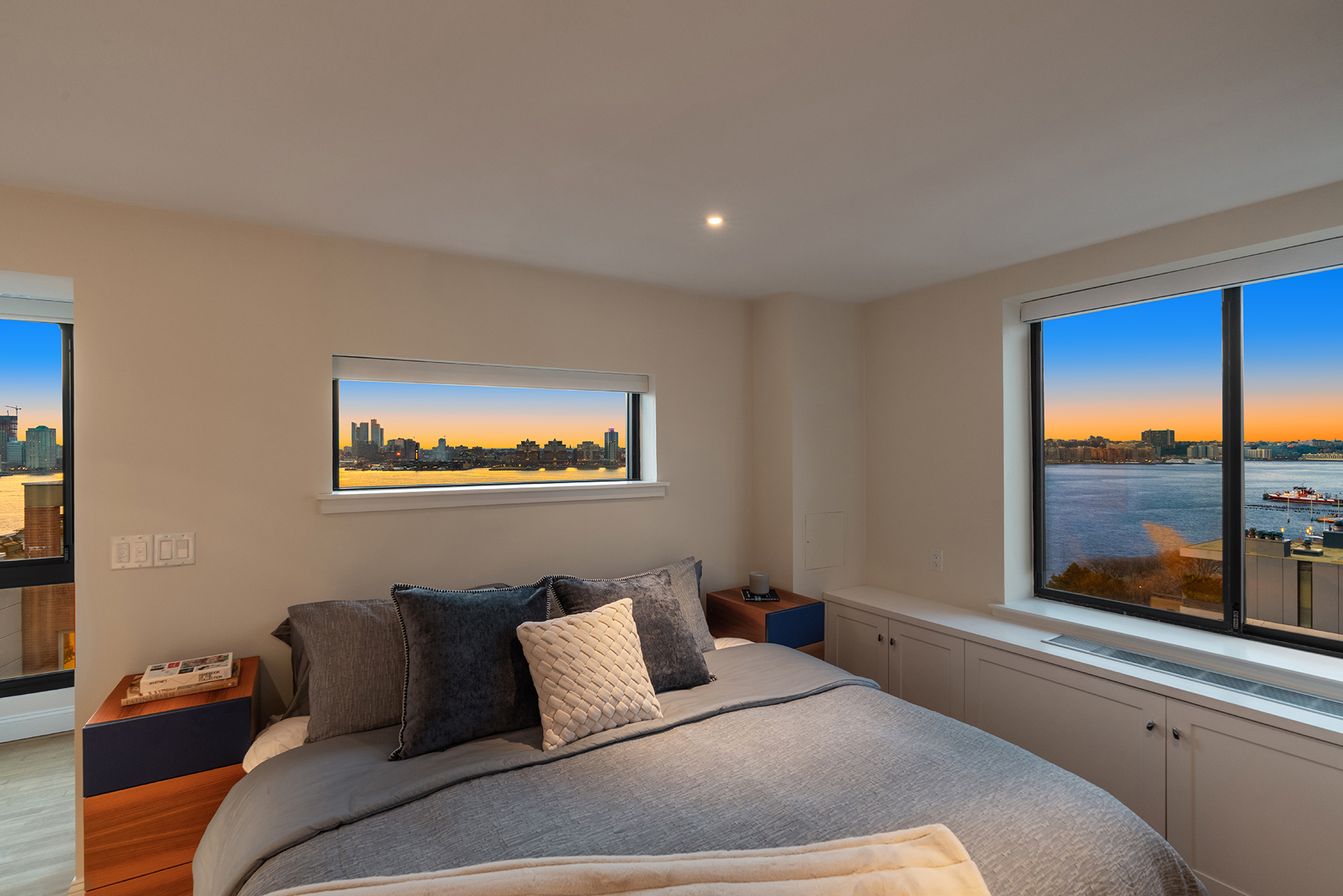 366 West 11th Street, Unit PHF Manhattan, NY 10014 - Photo 5 of 28 a bedroom with a bed and glass window
