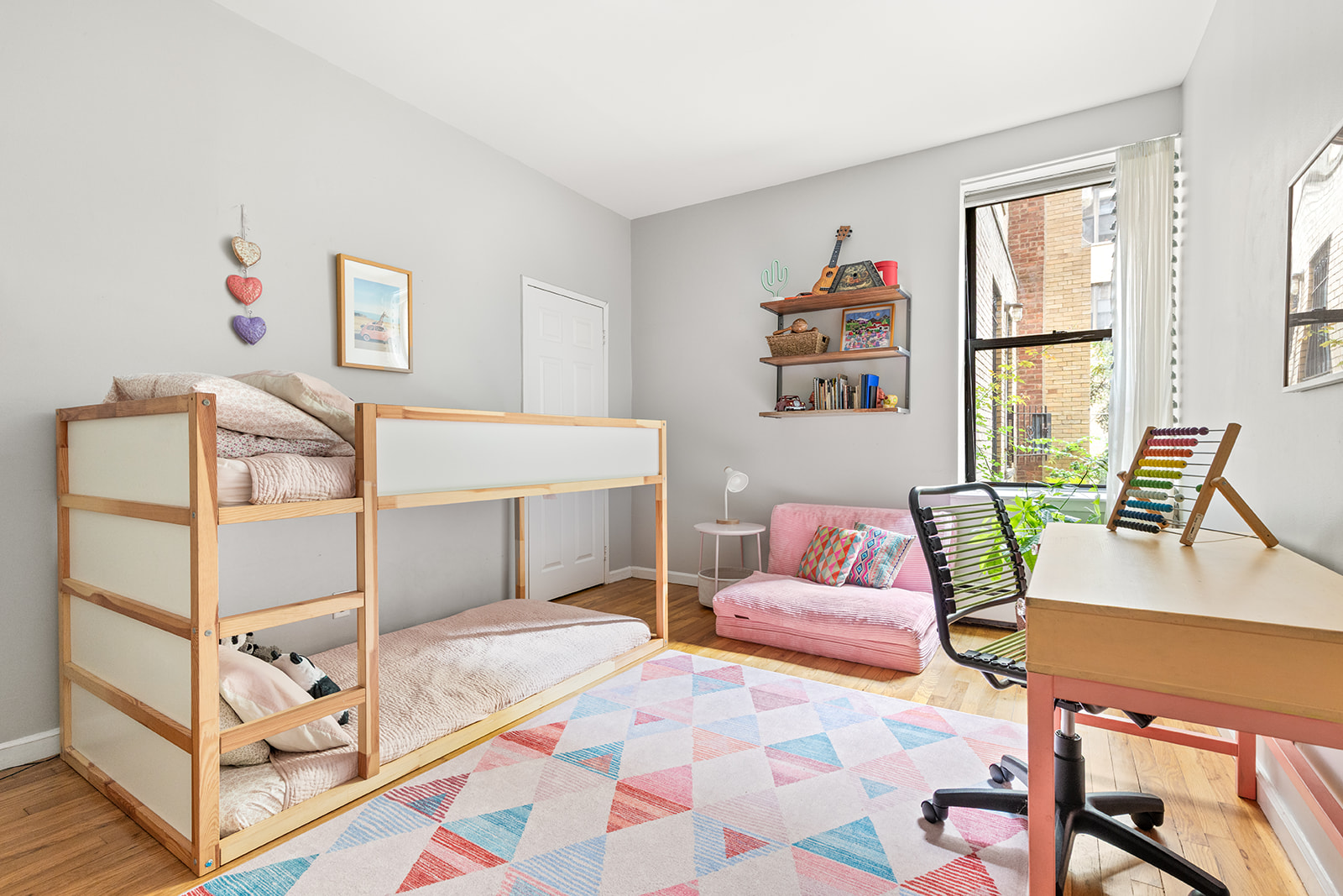 295 St Johns Place, Unit 1C Brooklyn, NY 11238 - Photo 11 of 17 a bedroom with a bed and a couch