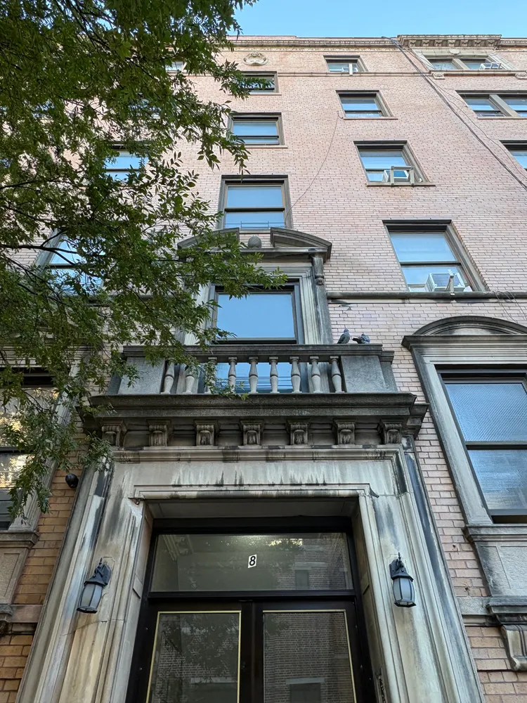 a stove top oven sitting inside of a kitchen