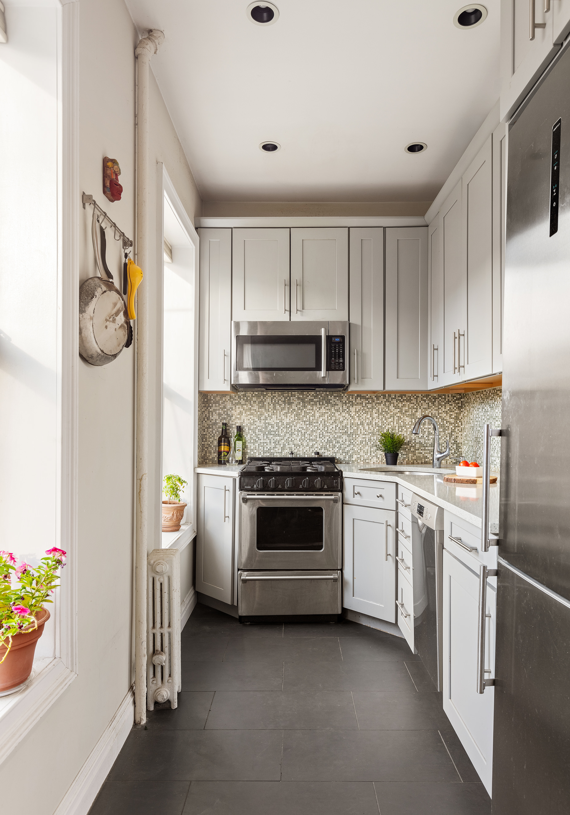 396 Degraw Street, Unit 2 Brooklyn, NY 11231 - Photo 2 of 5 a kitchen with a stove and a refrigerator
