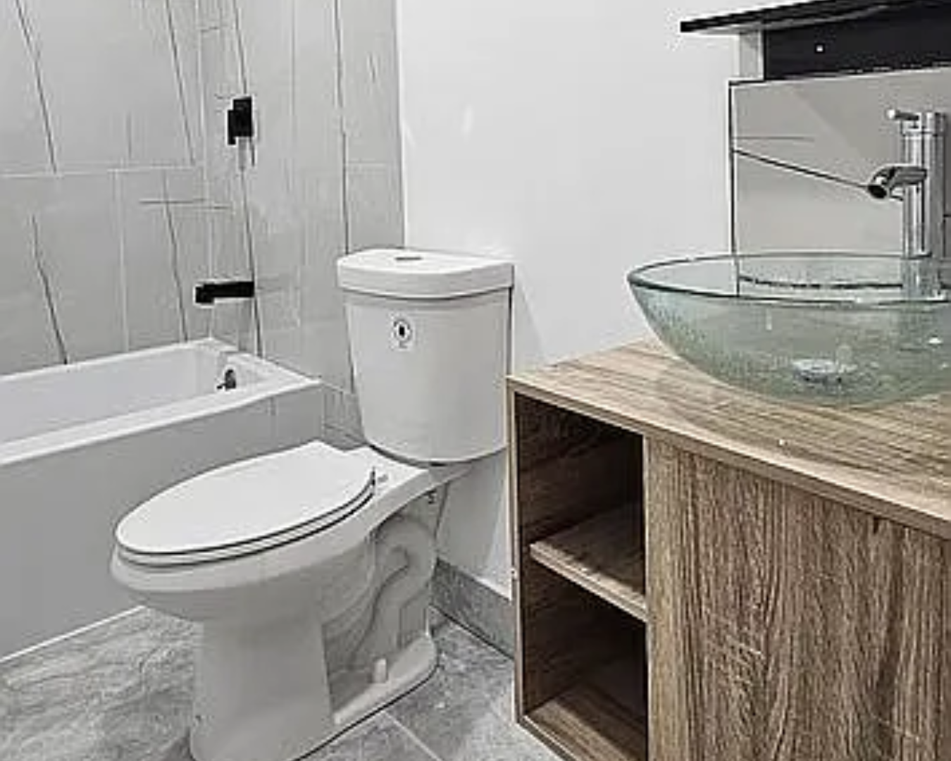 2822 Pine Tree Drive Miami Beach, FL 33140 - Photo 21 of 21 a bathroom with a granite countertop toilet sink and mirror