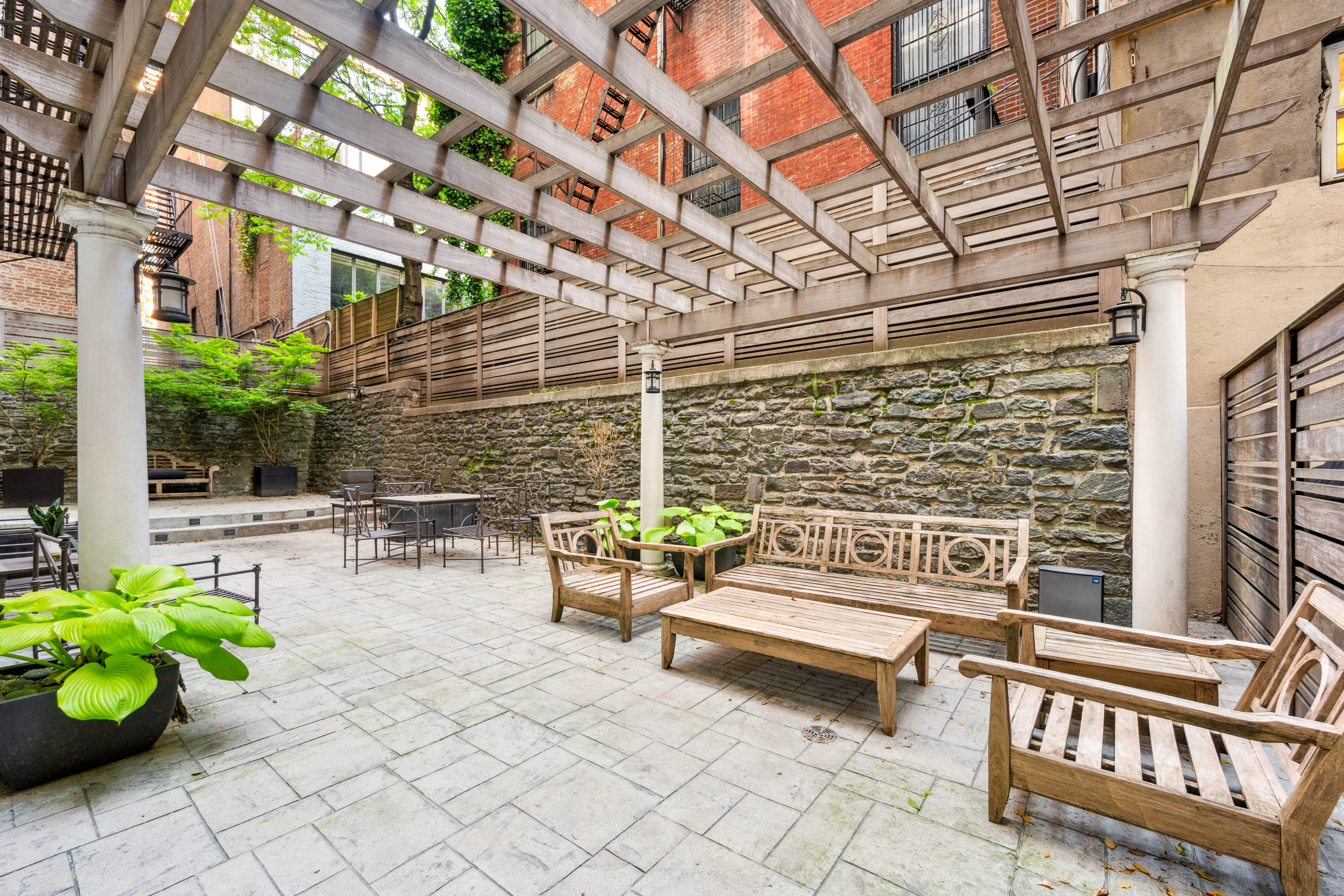 25 5th Avenue, Unit 6C Manhattan, NY 10003 - Photo 12 of 16 a roof deck with a couch and chairs