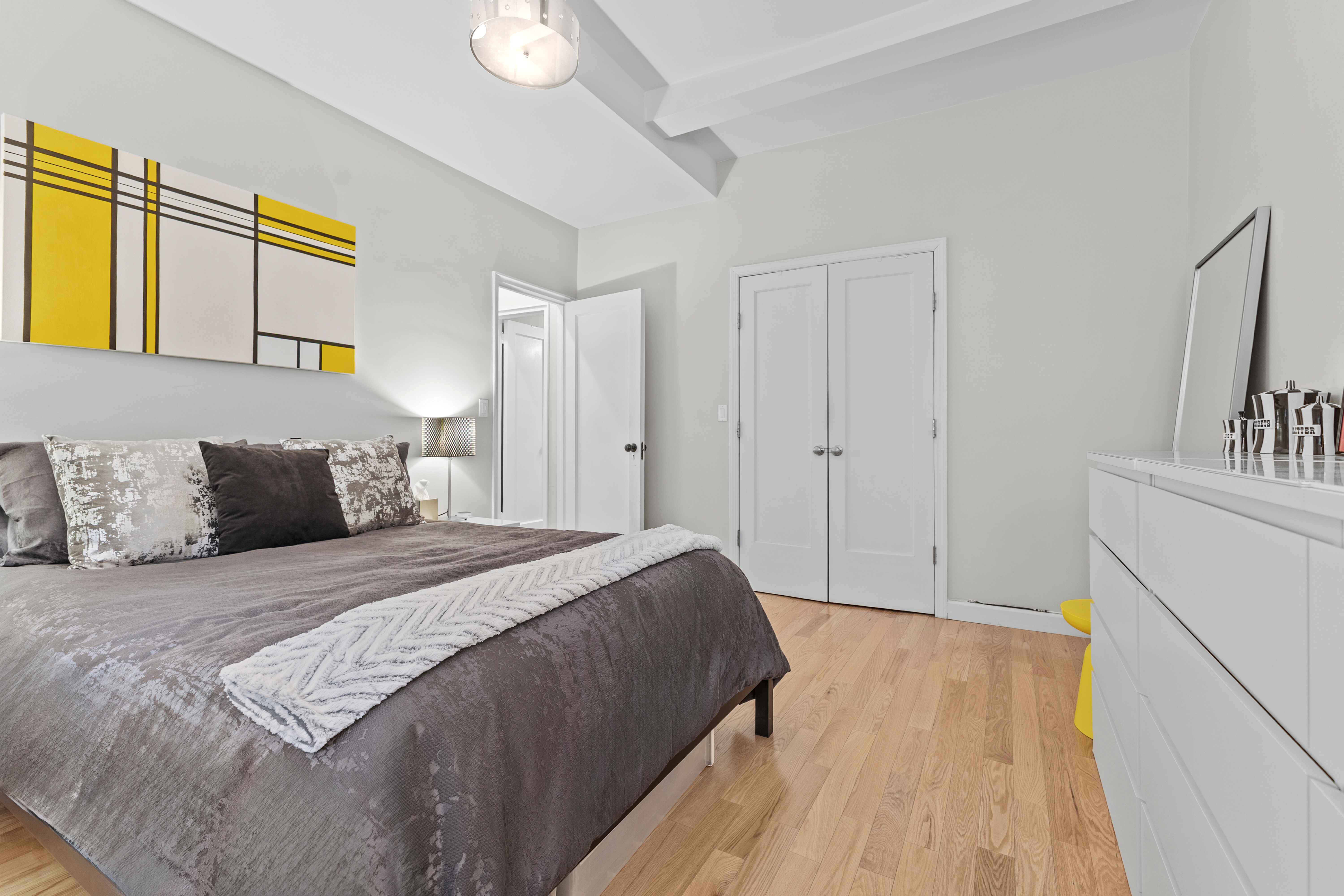 263 West End Avenue, Unit 6E Manhattan, NY 10023 - Photo 7 of 12 a bedroom with a bed and a cabinets