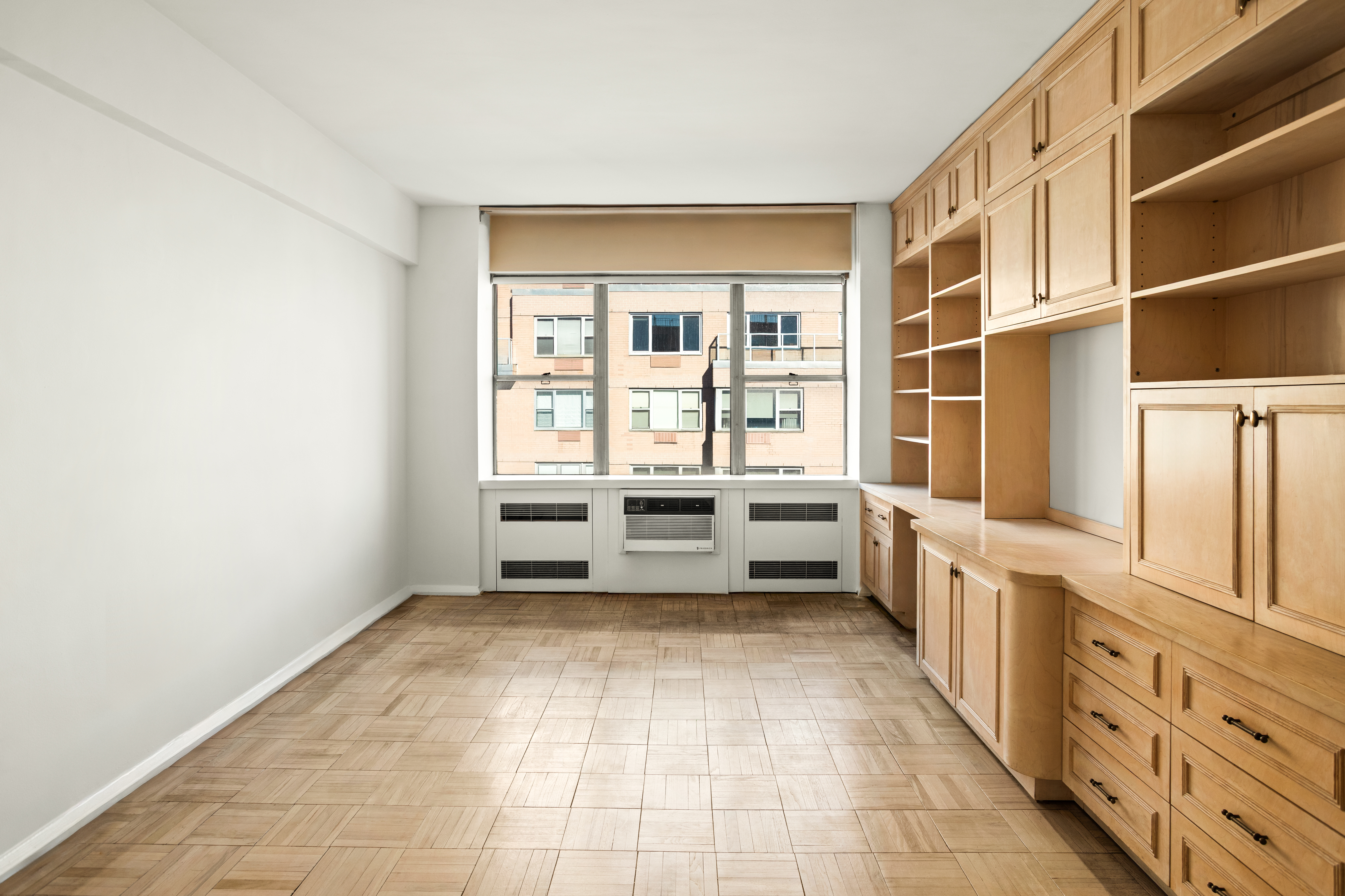 45 Sutton Place South, Unit 20D Manhattan, NY 10022 - Photo 9 of 12 a view of a kitchen with a stove