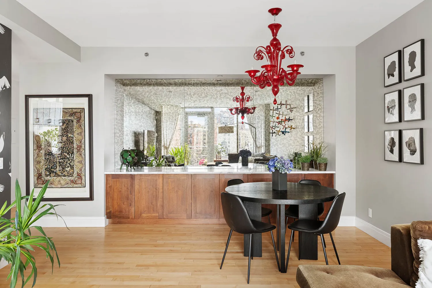 a view of a dining room with furniture and a chandelier