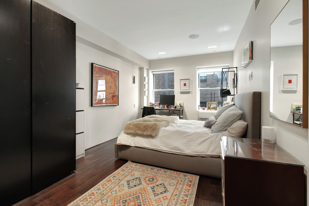 405 Broadway, Unit 4 Manhattan, NY 10013 - Photo 12 of 19 a bed room with a bed and a window