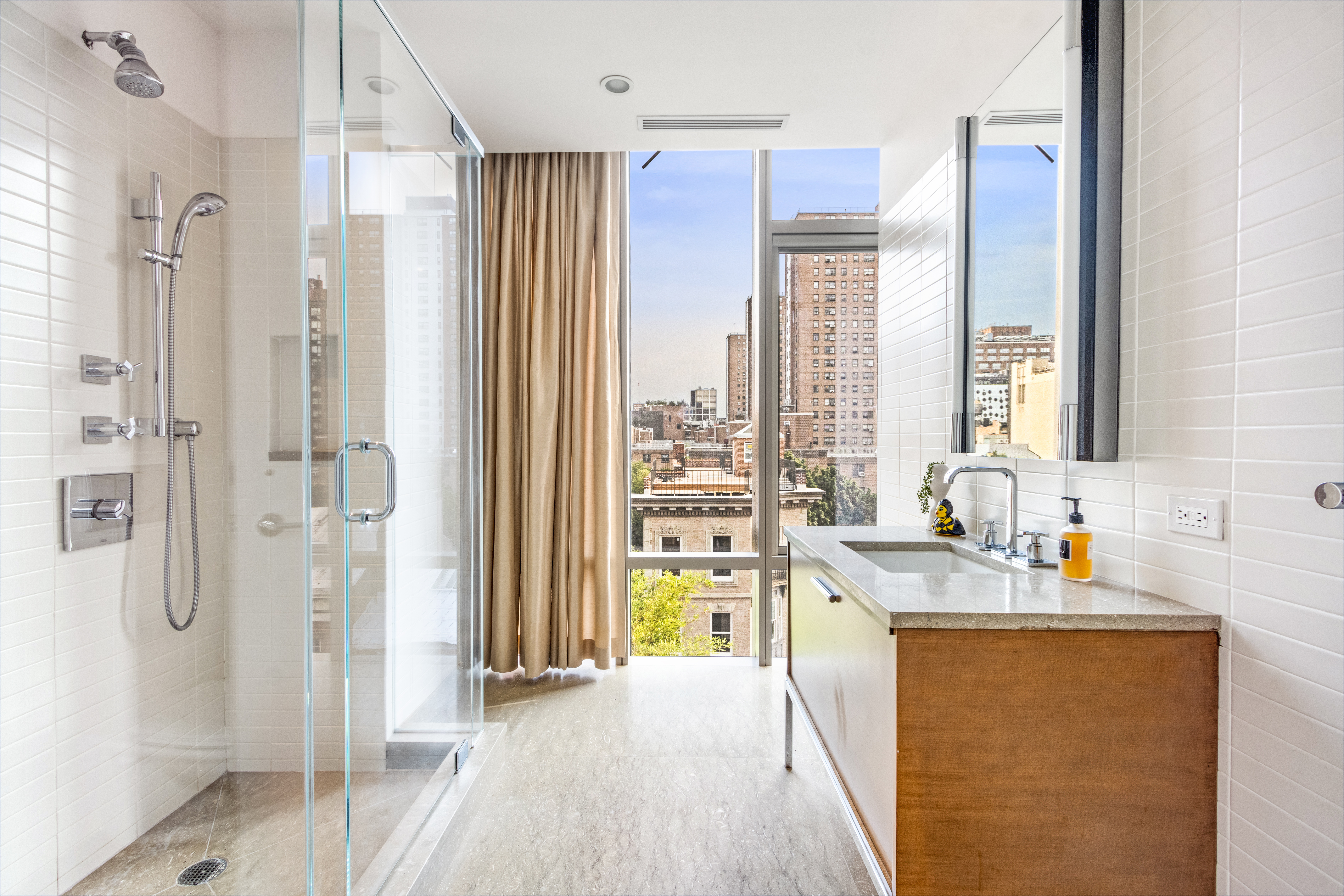 177 9th Avenue, Unit PHA Manhattan, NY 10011 - Photo 16 of 28 a bathroom with a tub sink and shower