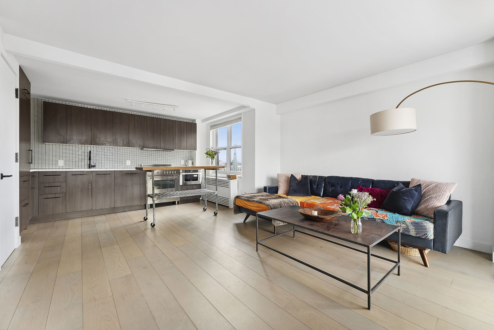 175 West 95th Street, Unit 18G Manhattan, NY 10025 - Photo 3 of 14 a living room with furniture and a wooden floor