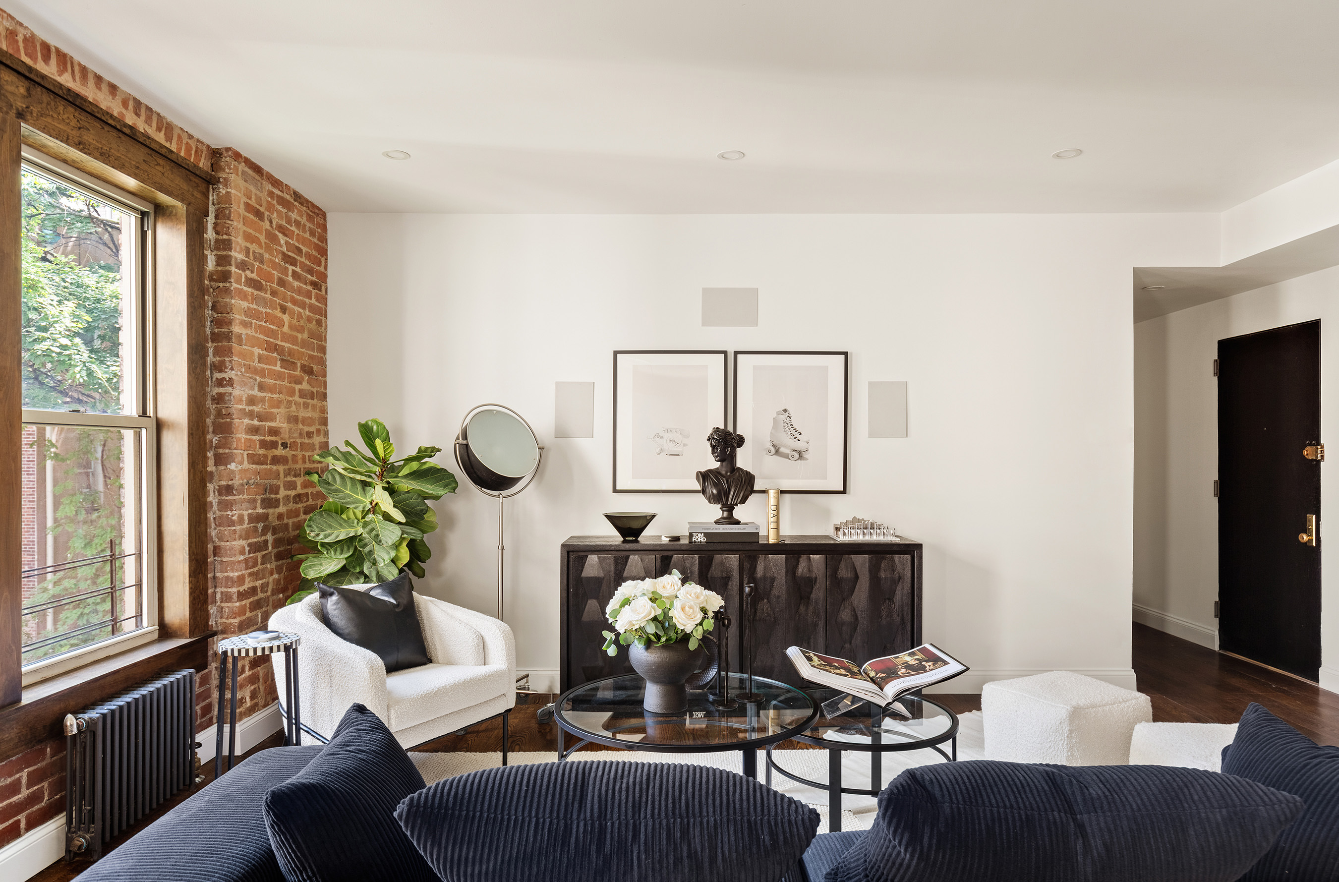 311 West 97th Street, Unit 5N Manhattan, NY 10025 - Photo 7 of 16 a living room with furniture and wooden floor