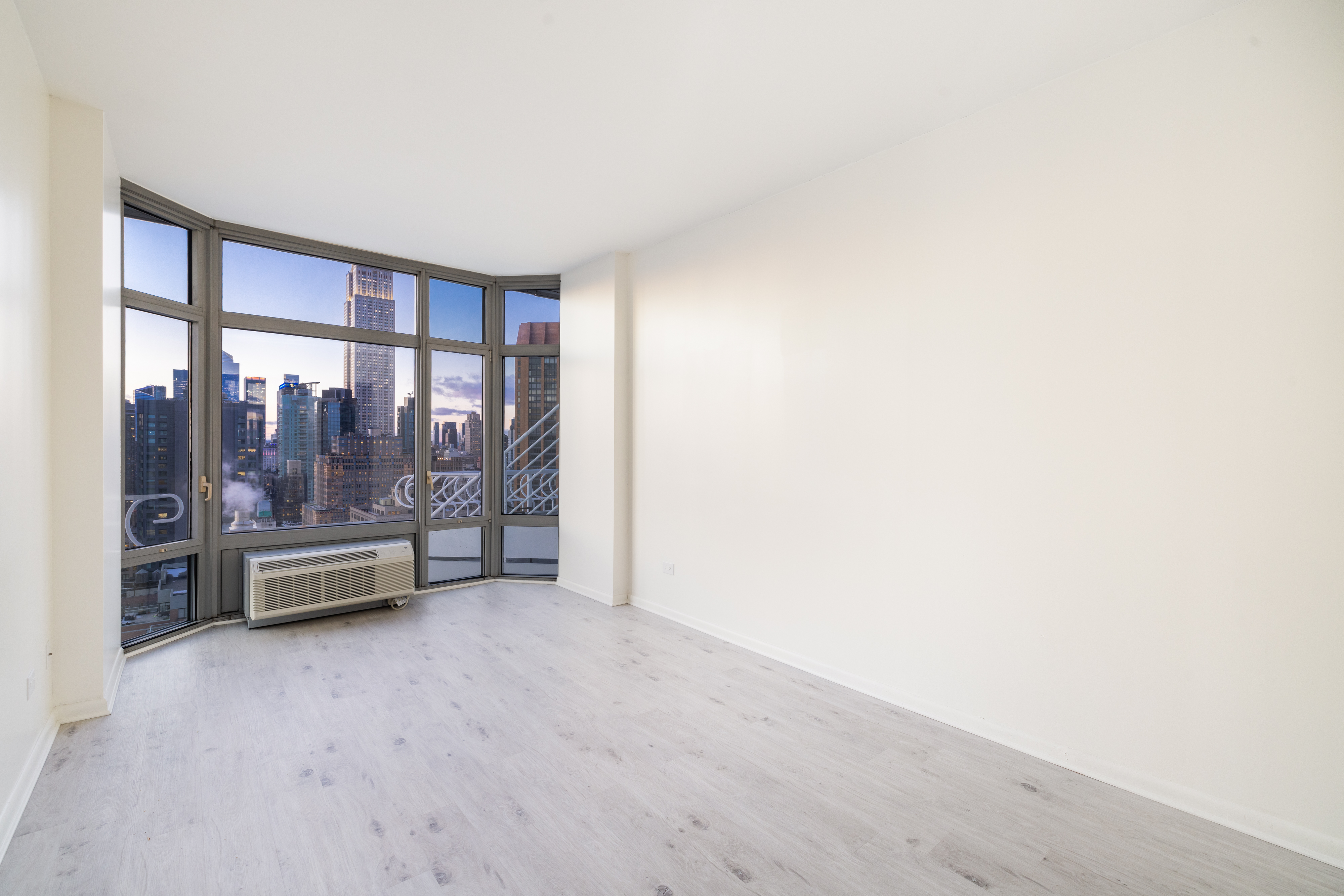 200 East 32nd Street, Unit 35C Manhattan, NY 10016 - Photo 8 of 26 a view of an empty room with a window