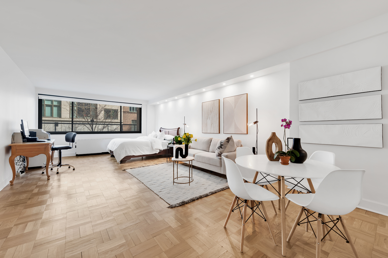 40 East 80th Street, Unit 2C Manhattan, NY 10075 - Photo 1 of 6 a living room with furniture and a window