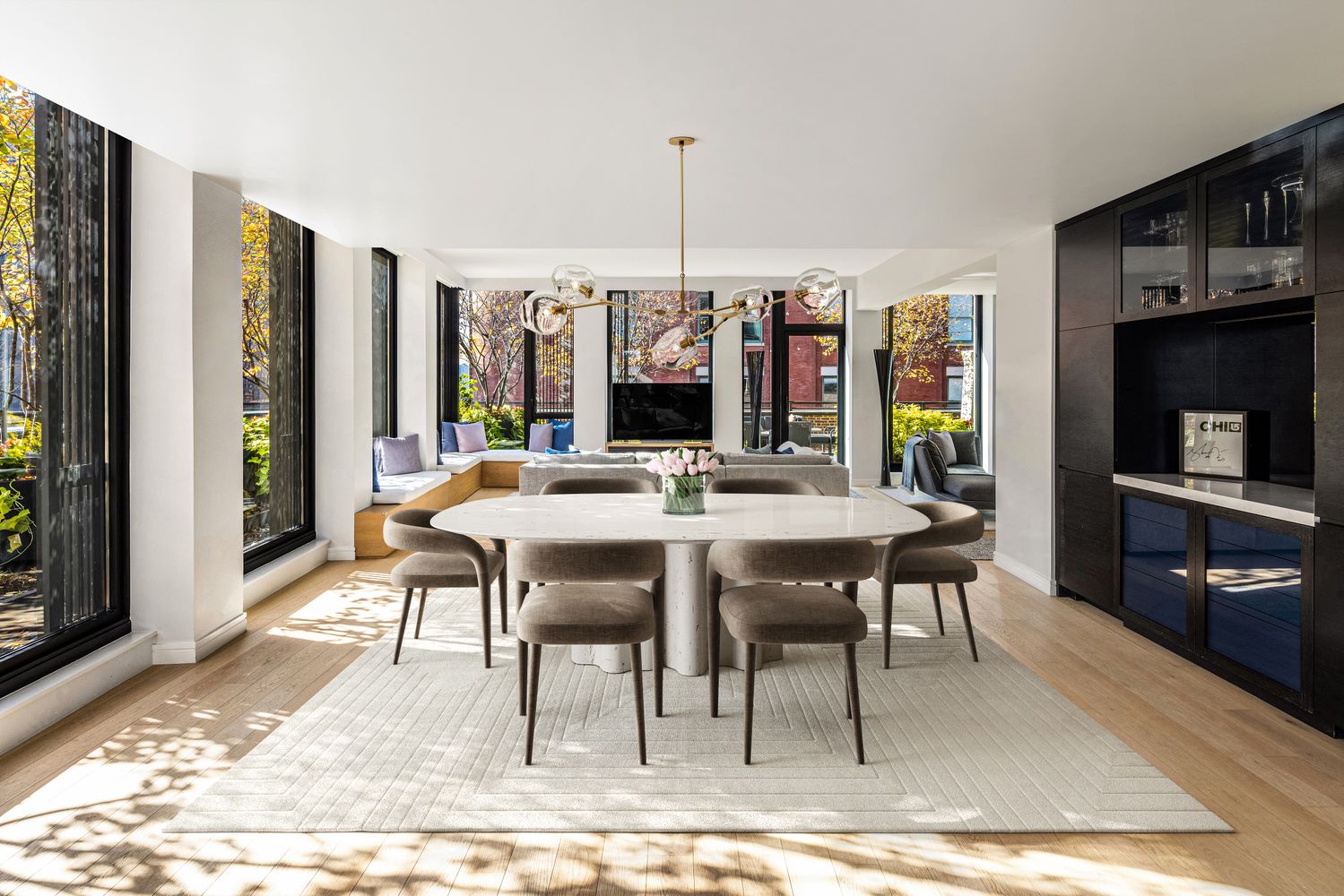 a view of a dining room with furniture window and wooden floor