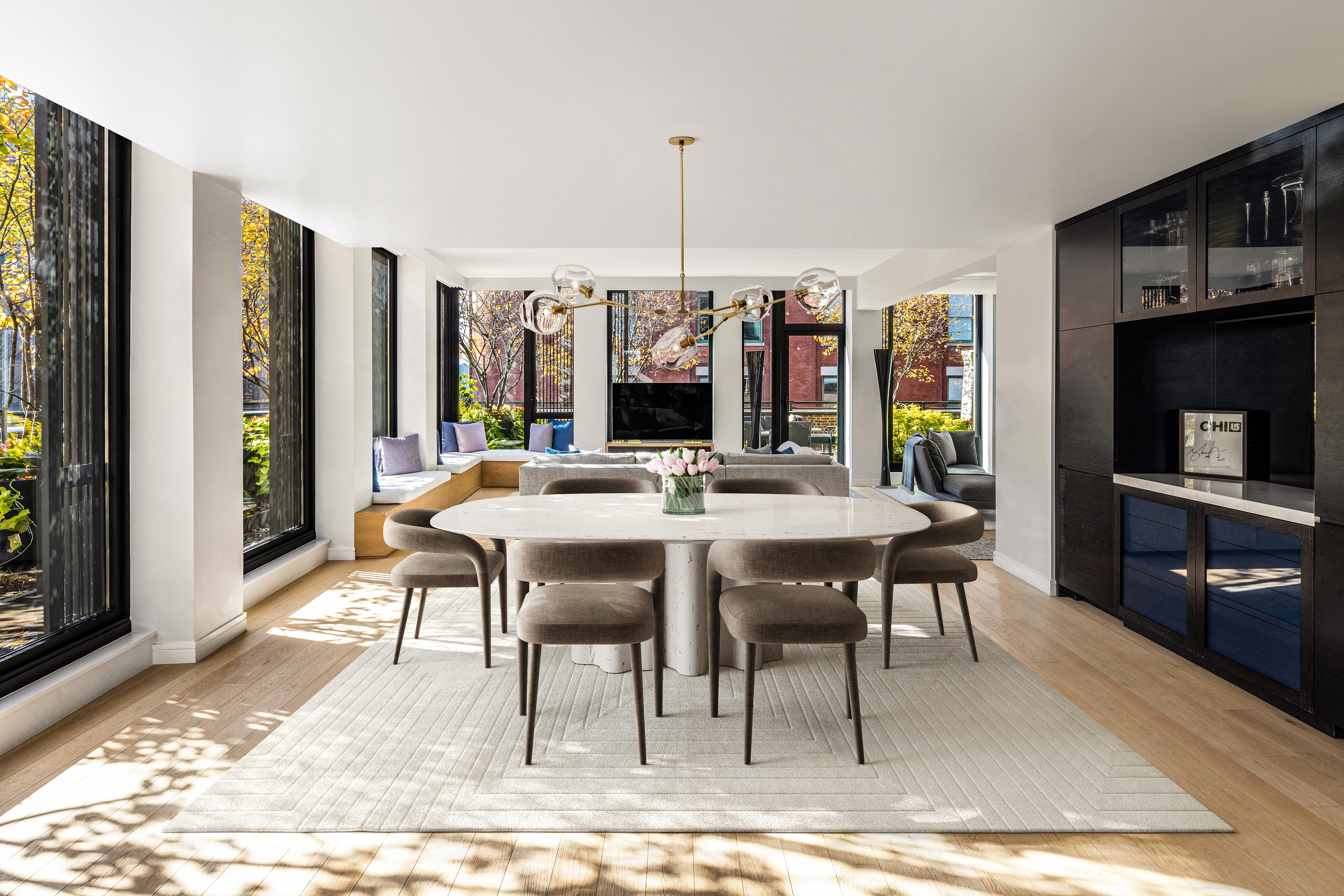 100 Barrow Street, Unit 7/8A Manhattan, NY 10014 - Photo 3 of 23 a view of a dining room with furniture window and wooden floor