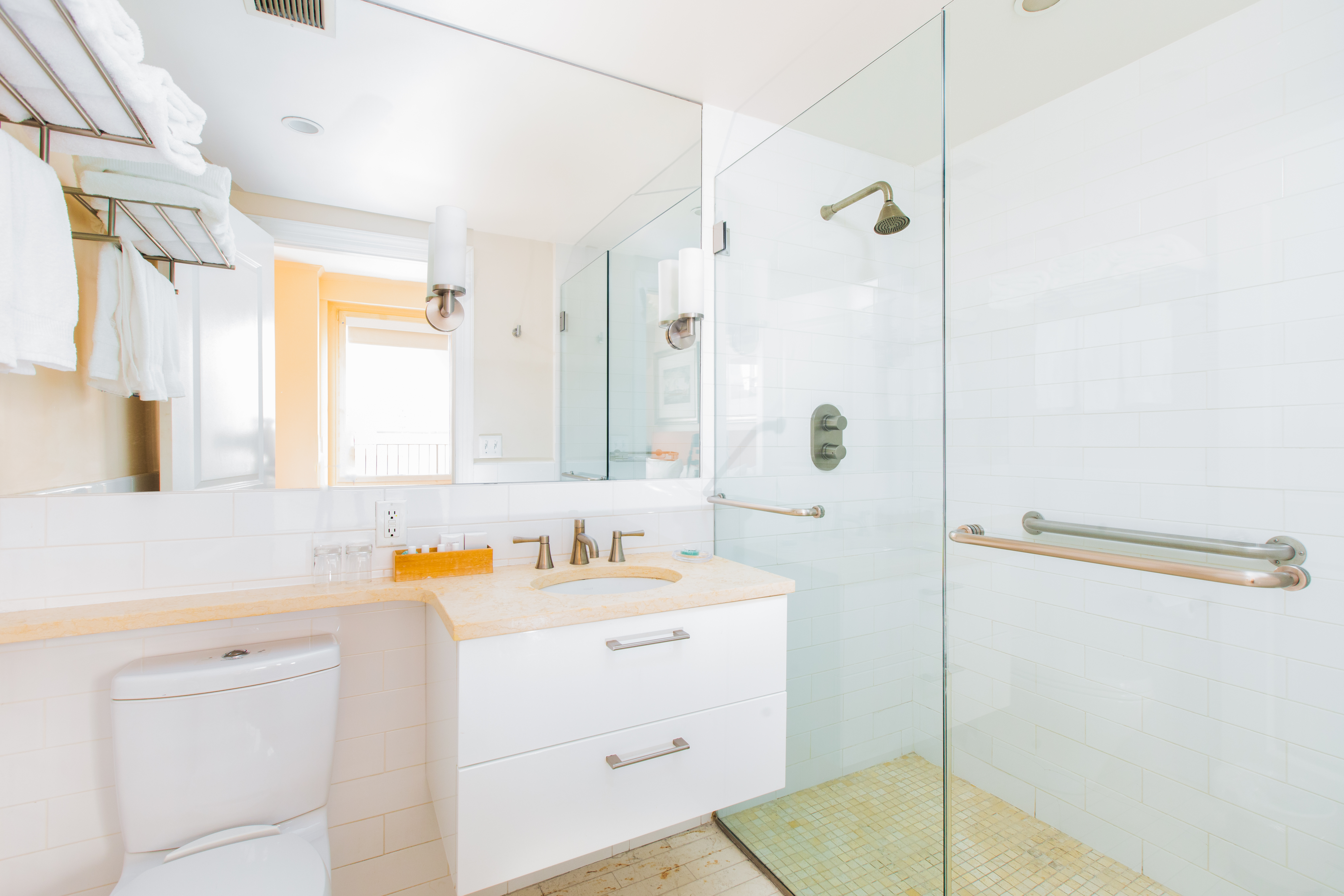 111 East 56th Street, Unit 1705 Manhattan, NY 10022 - Photo 3 of 12 a bathroom with a sink and a mirror