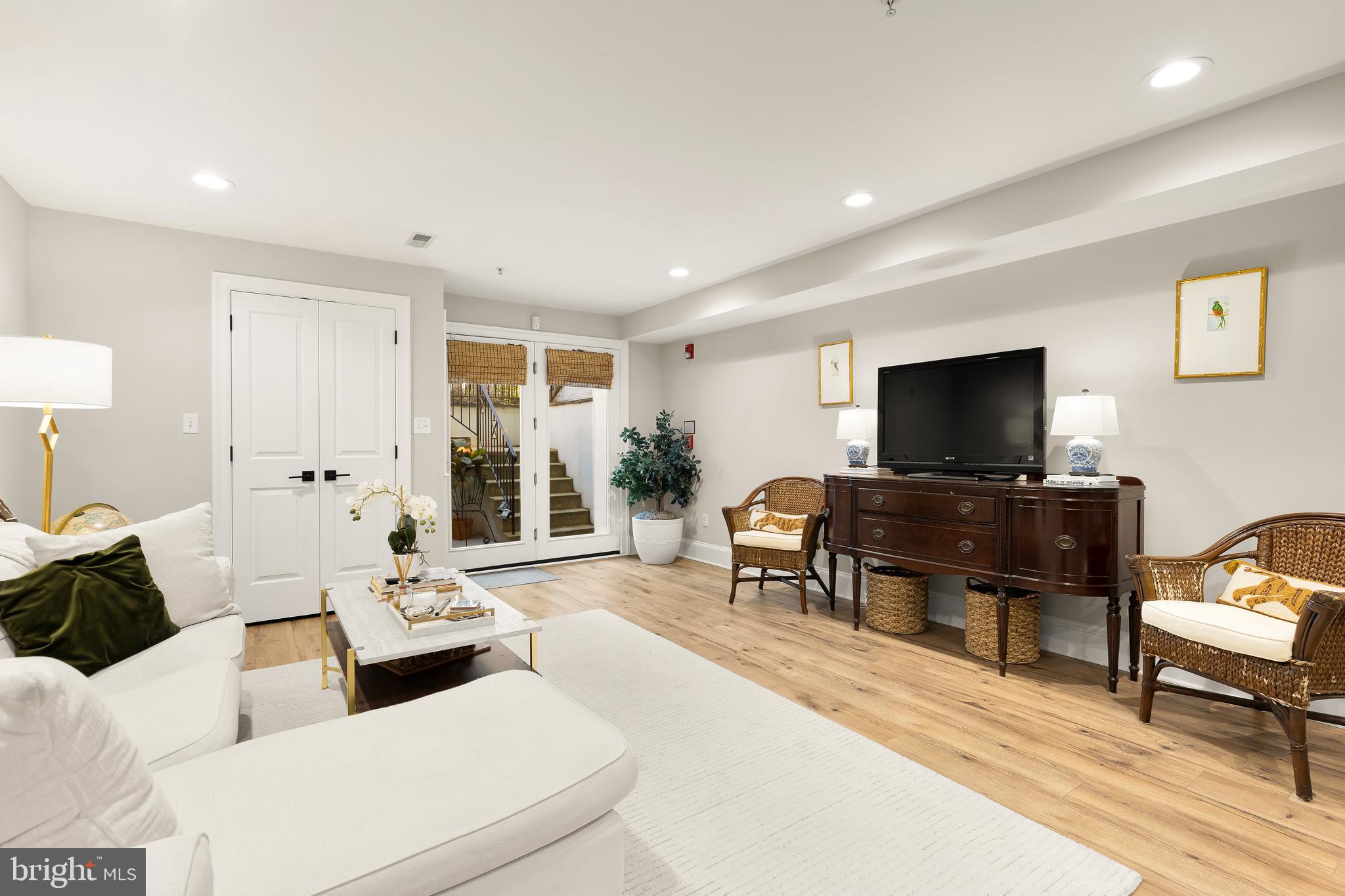 1354 Kenyon Street Northwest, Unit G Washington, DC 20010 - Photo 9 of 37 a living room with furniture and a flat screen tv