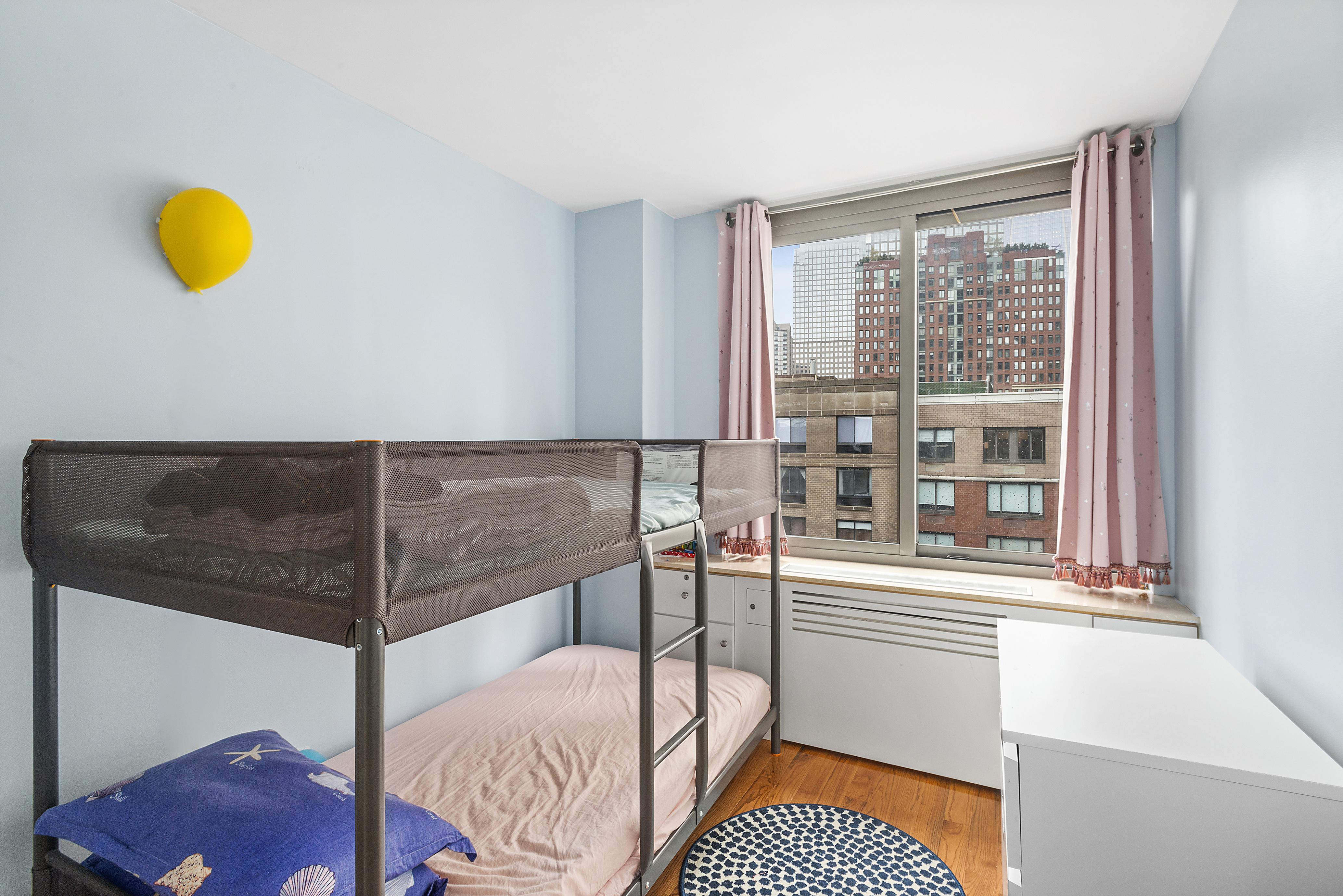 2 South End Avenue, Unit 9E Manhattan, NY 10280 - Photo 2 of 7 a bedroom with a bed and a window