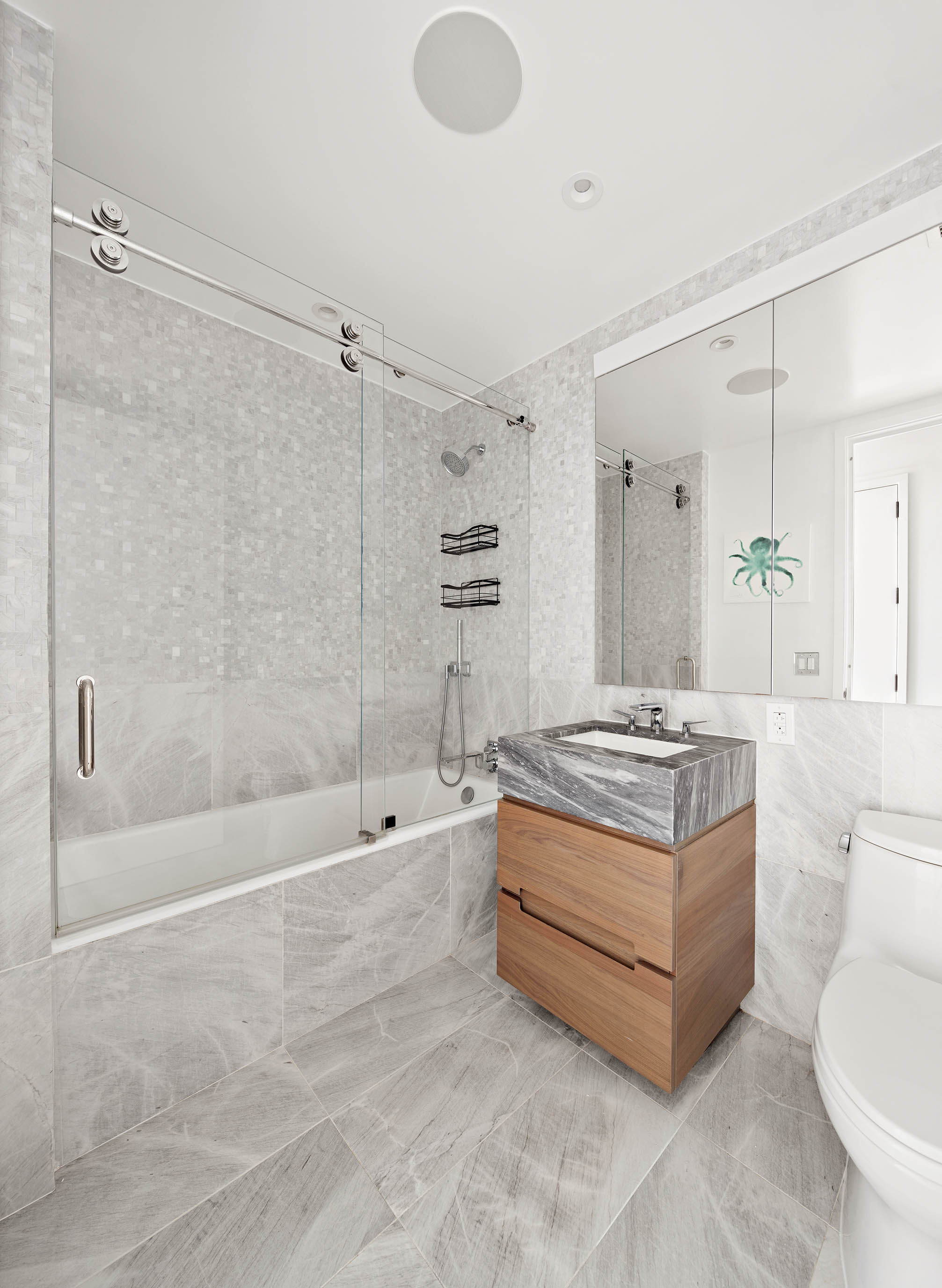 30 Riverside Boulevard, Unit 33D Manhattan, NY 10069 - Photo 9 of 18 a bathroom with a granite countertop sink a toilet bathtub and shower