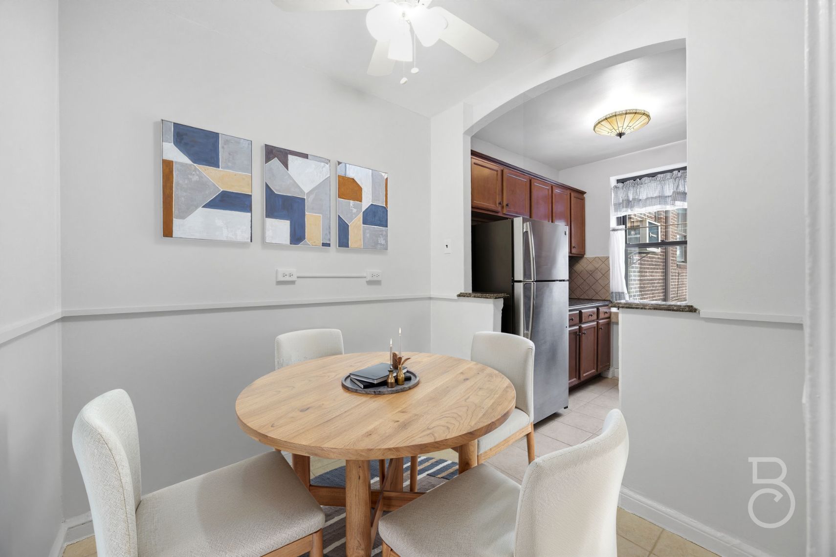 78-15 19th Drive, Unit B2 Queens, NY 11370 - Photo 4 of 17 a view of a dining room with furniture and a chandelier