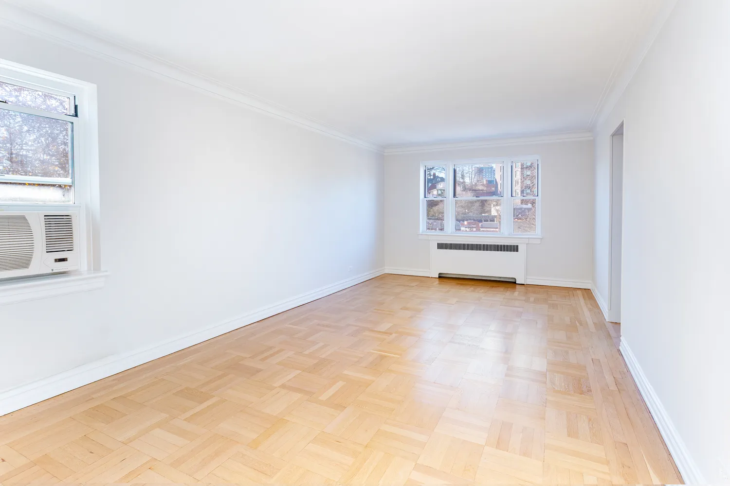 a view of an empty room with a window