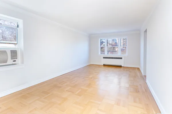 a view of an empty room with a window