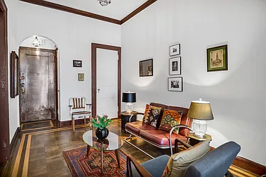 284 5th Avenue, Unit 5F Manhattan, NY 10001 - Photo 6 of 19 a living room with furniture and wooden floor