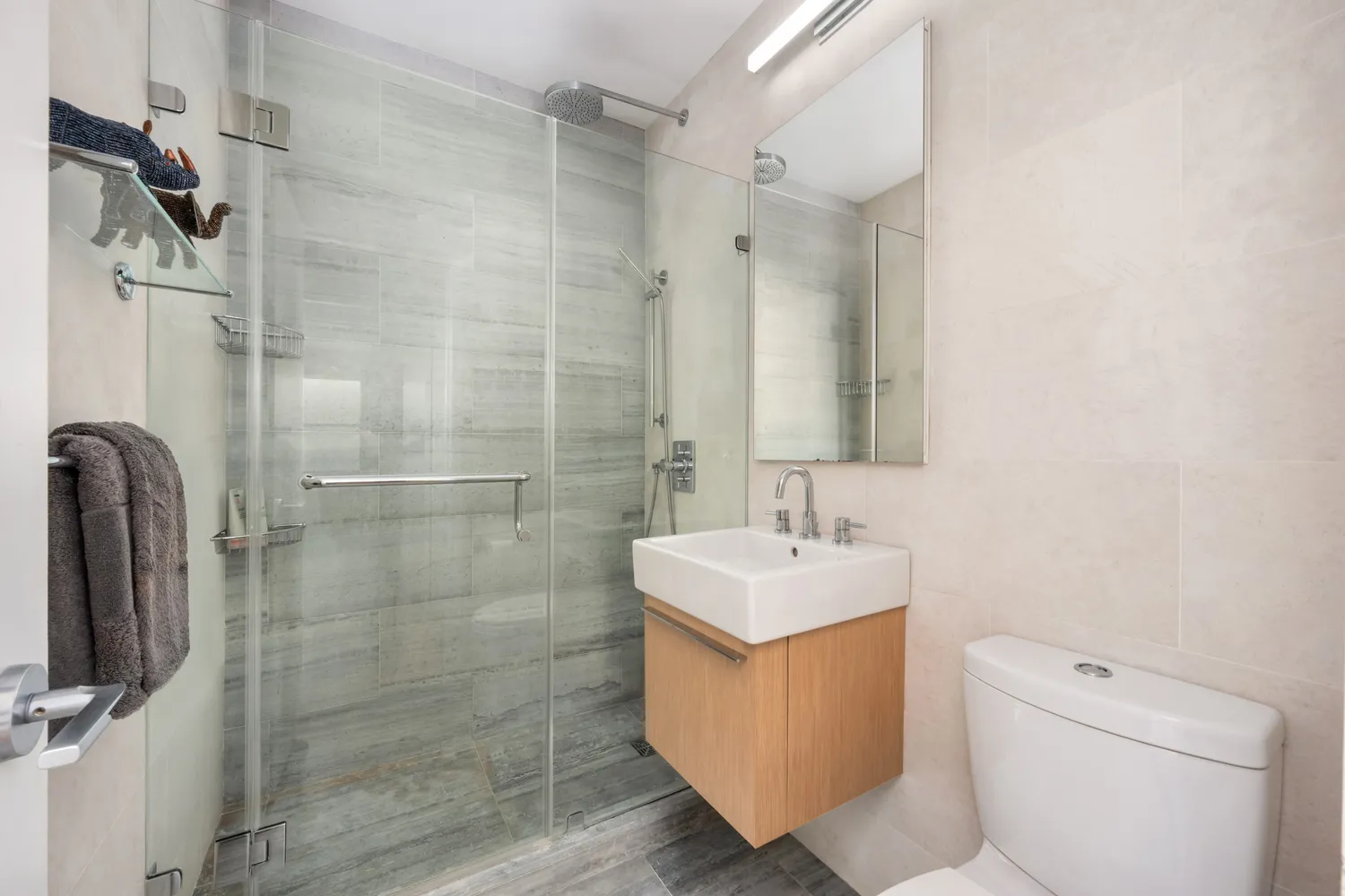 a bathroom with a sink toilet and shower